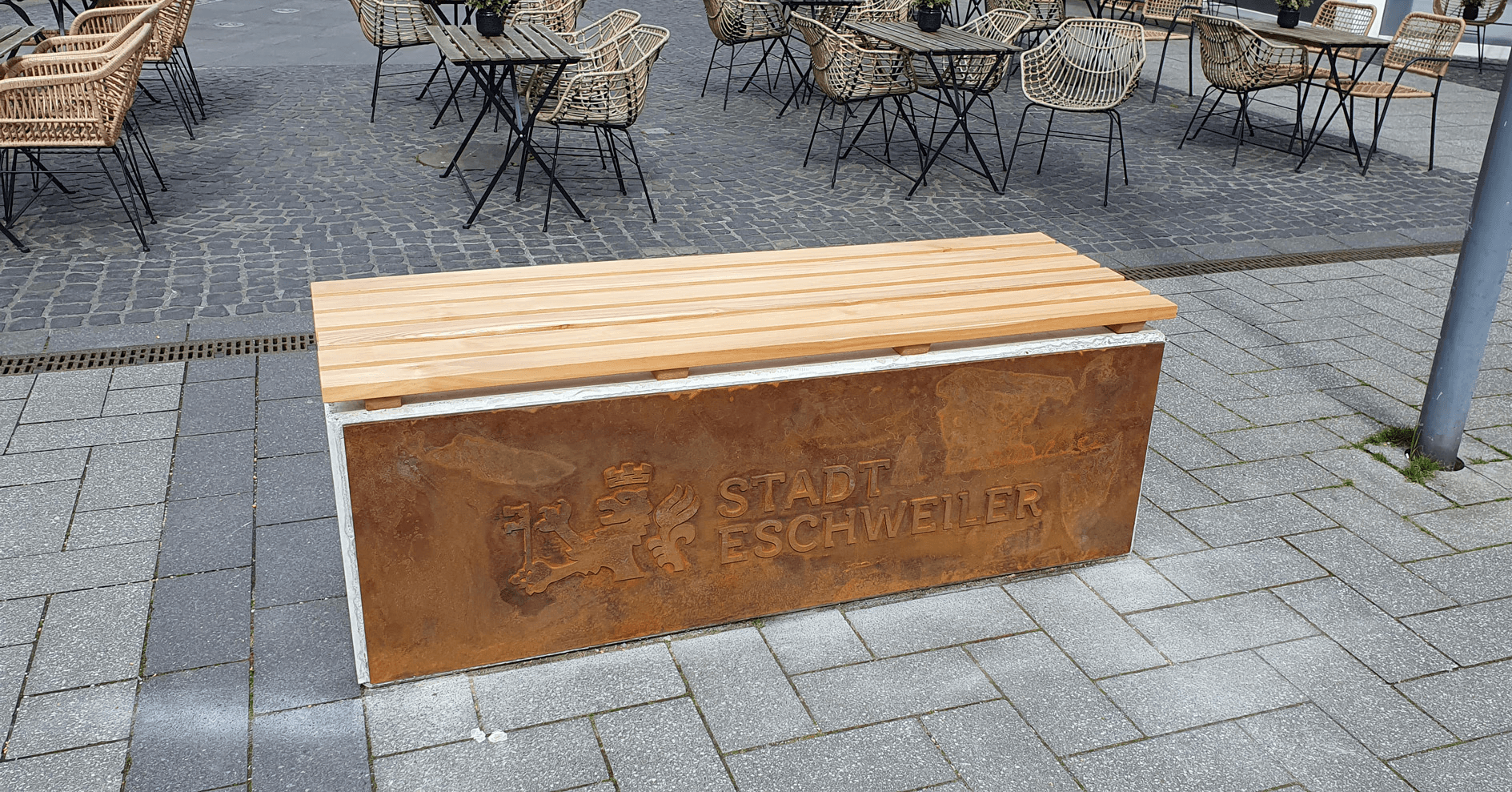 Stack of modern books and magazine with minimalist cover design on leather chair