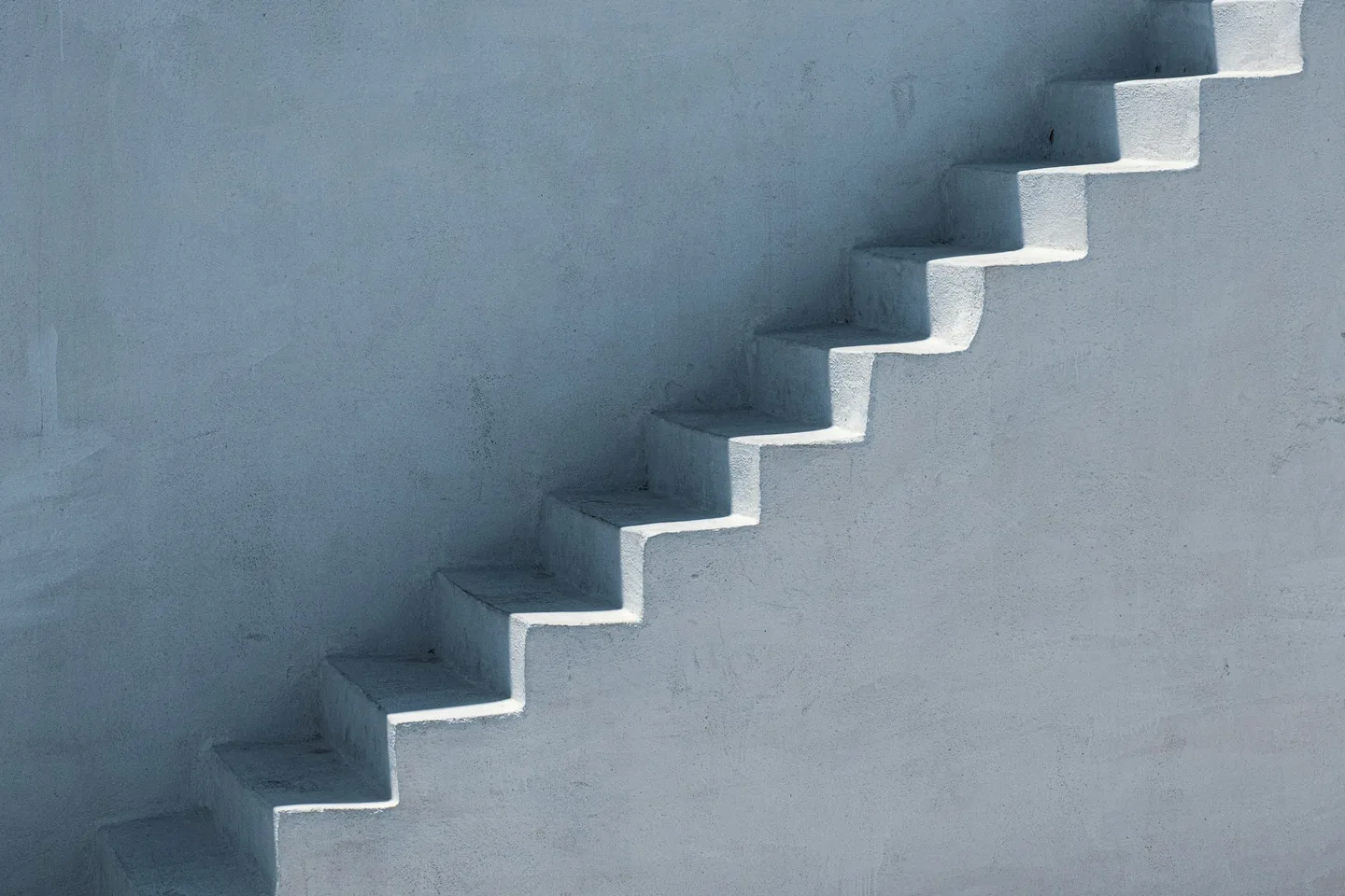 A plain stairway with repeating steps and no people in view.