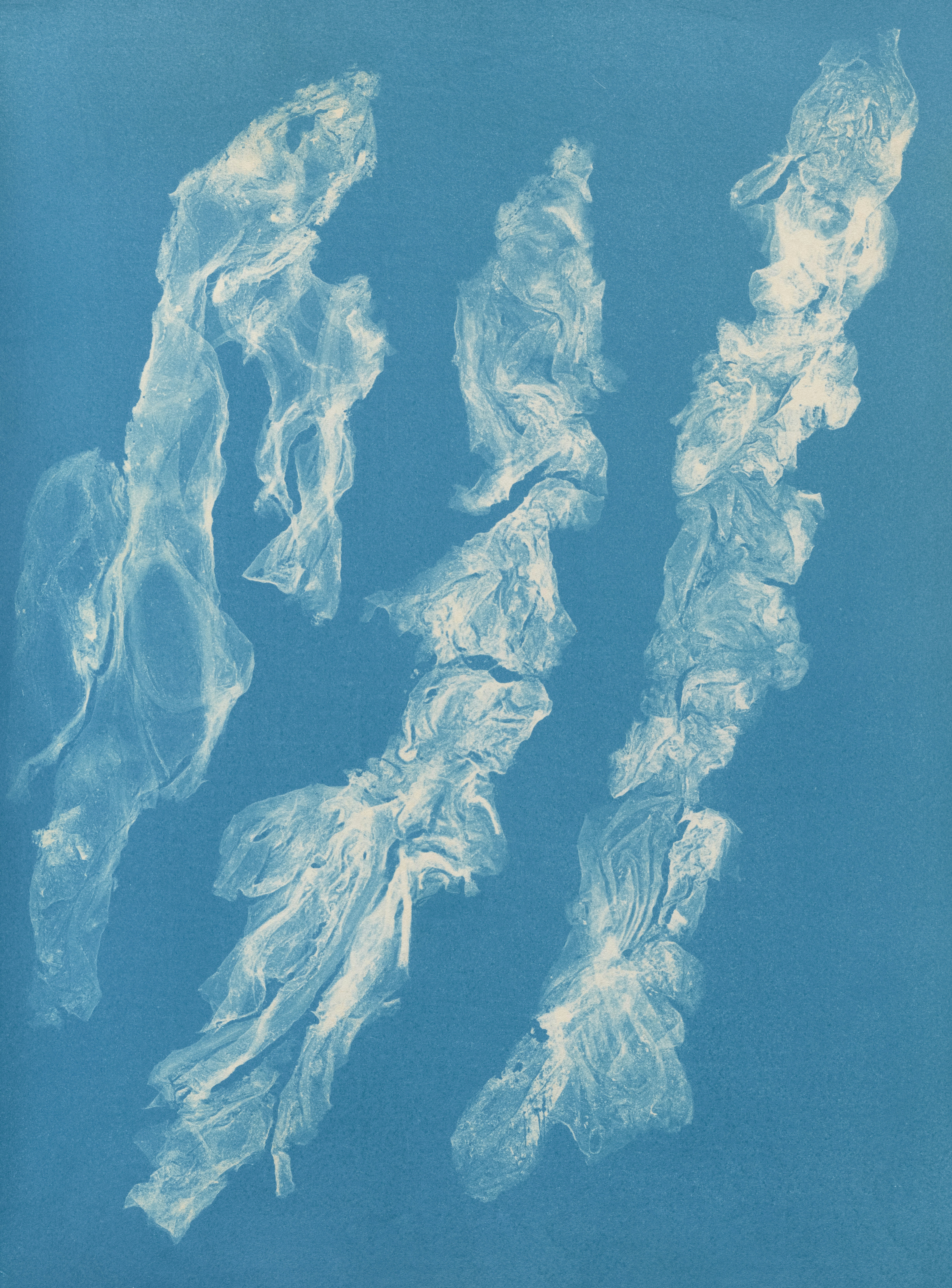 Three abstract white forms on blue background