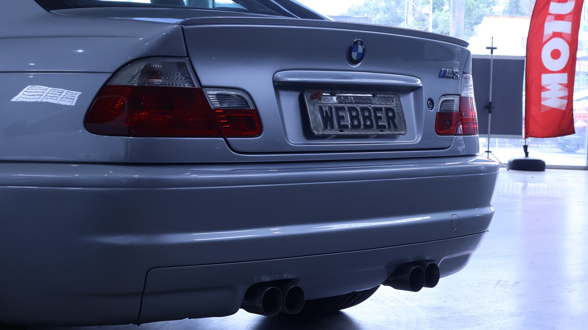 Rear view of a sleek sportscar, ideal for highlighting car rental style and design