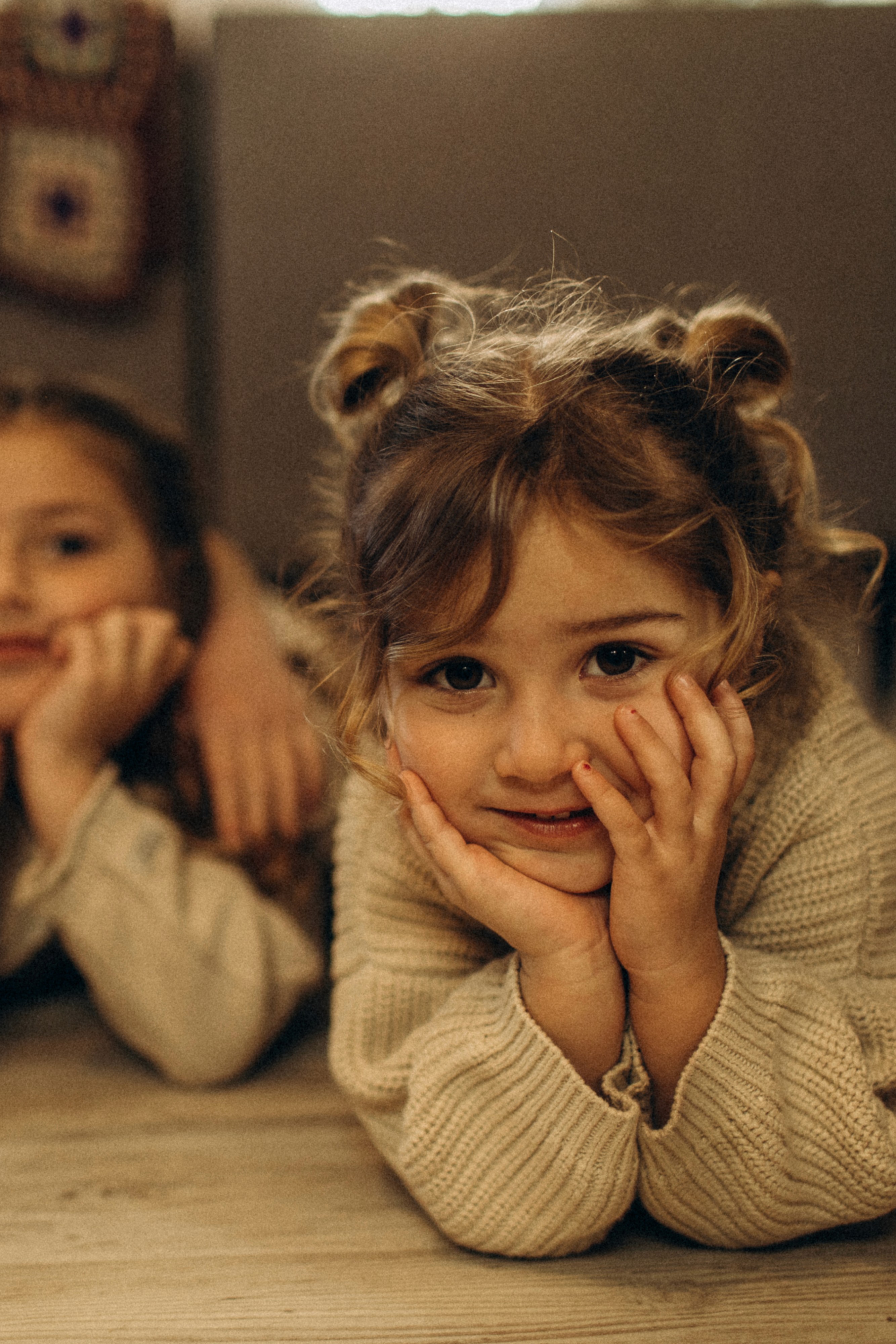 Child laughing during an at-home lifestyle photography session.