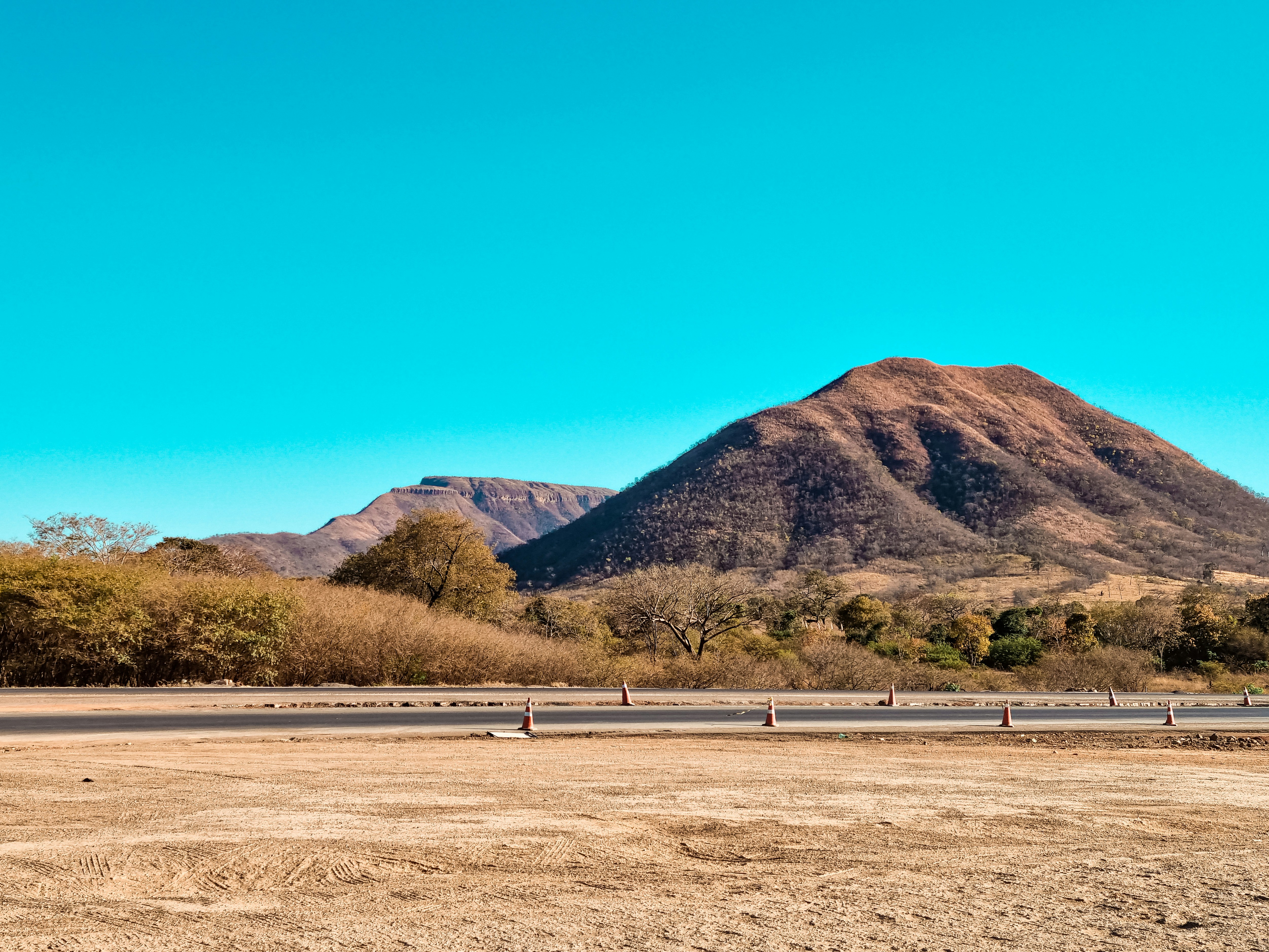 green and brown mountains under blue sky during daytime
