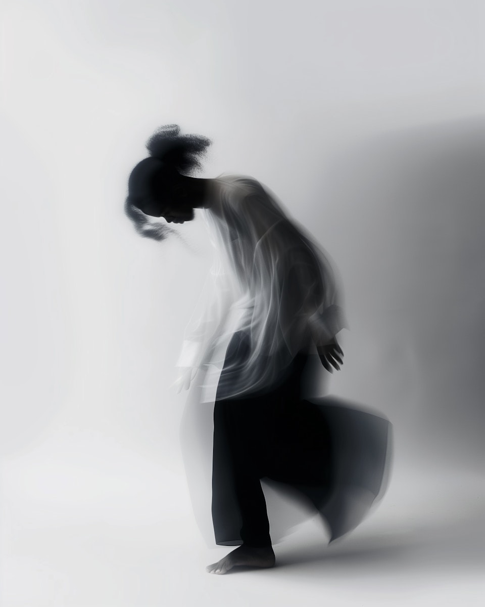 Studio portrait of a woman with soft lighting and neutral tones