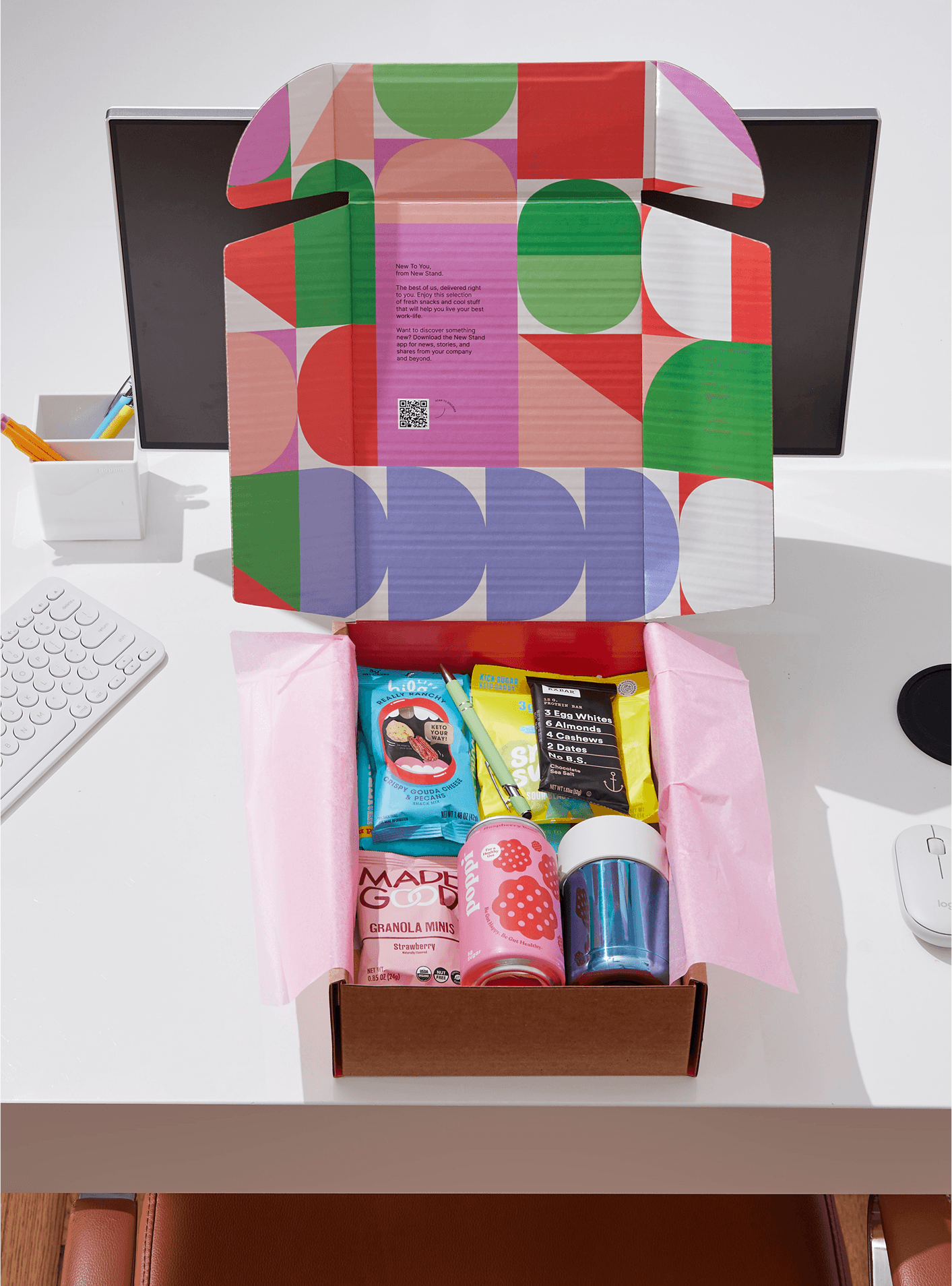 Streetside billboard with flyposters of the Batch.Works brand and illustrations