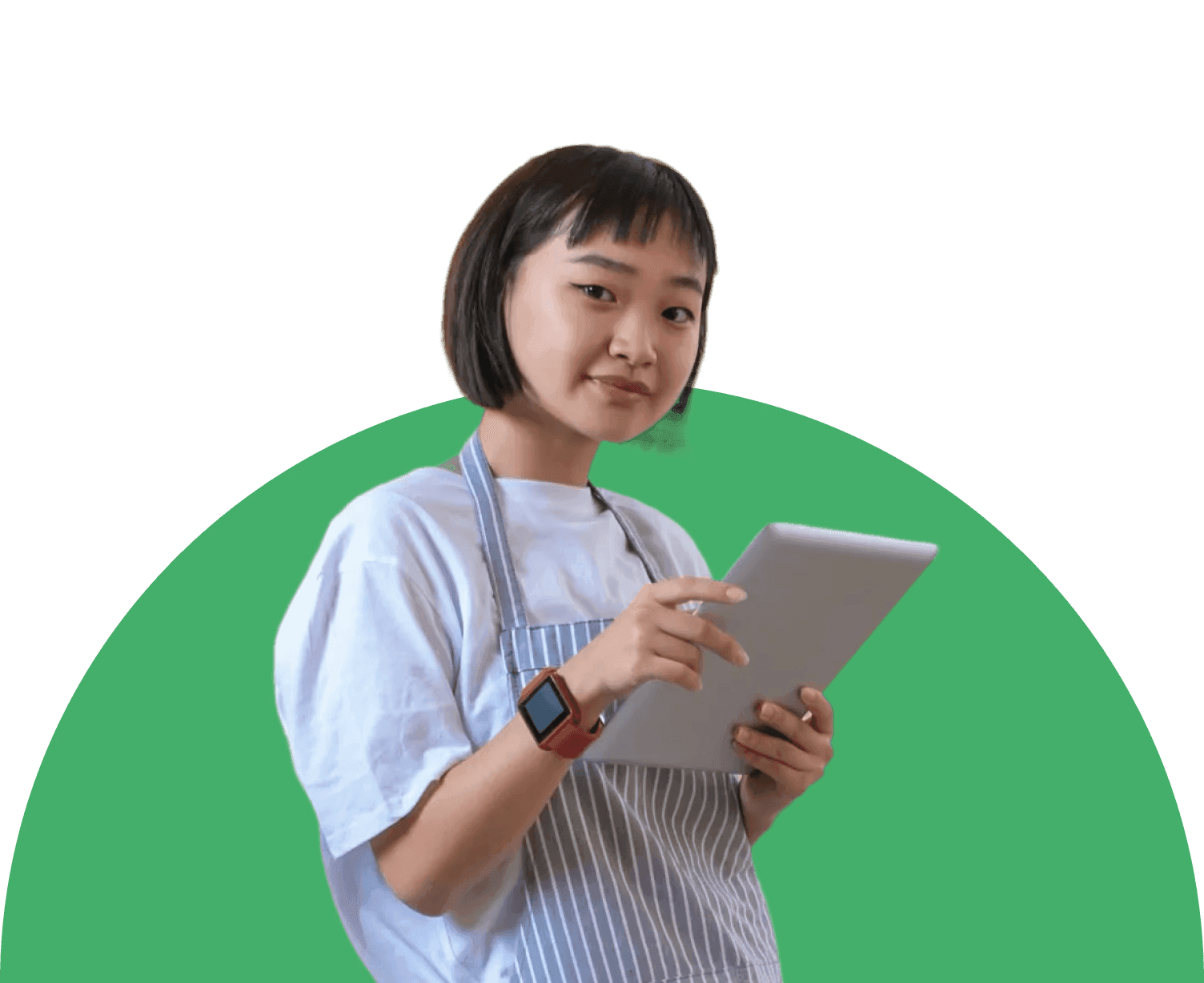Young woman wearing a striped apron uses a tablet to control a smart kitchen appliance, representing seamless connected cooking with Fresco