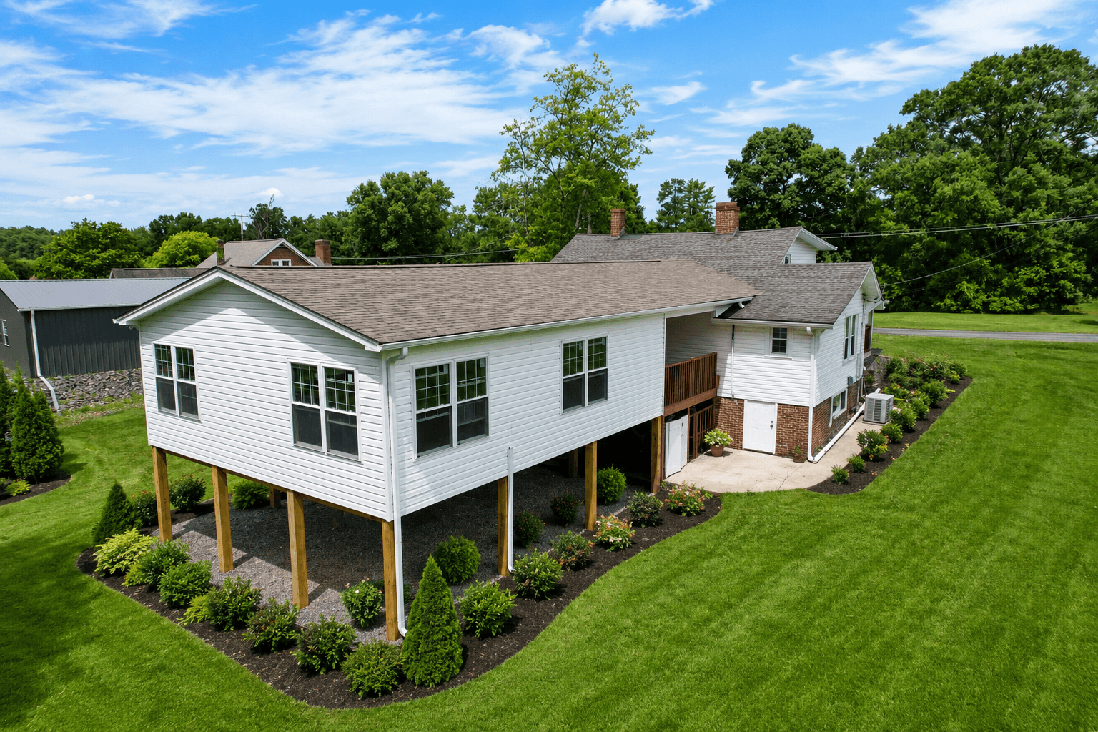 Completed custom home addition with breezeway renovation, vinyl siding, and new roofing in Mount Airy NC.