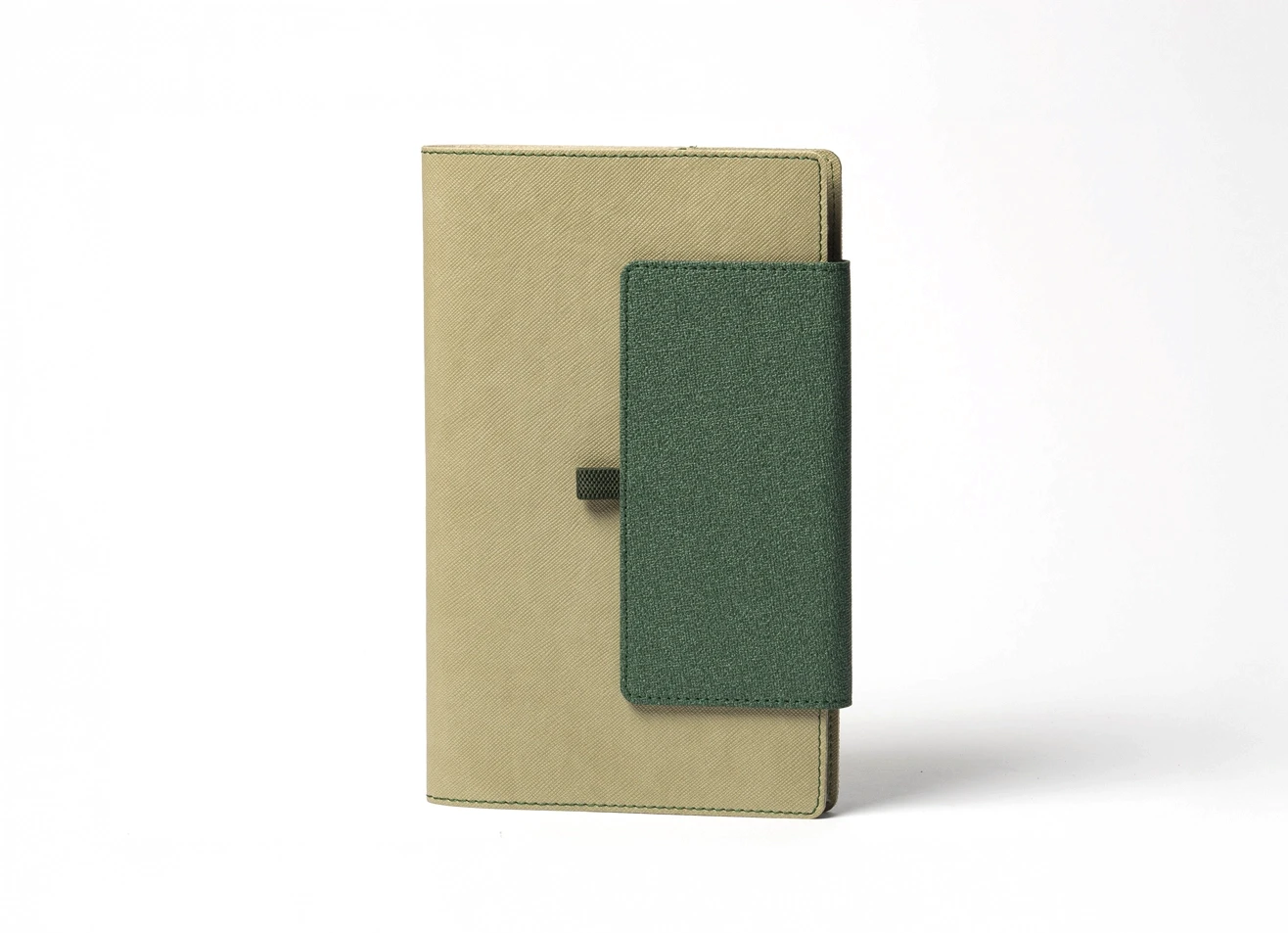 Front view of standing beige notebook with wide green vertical closure.