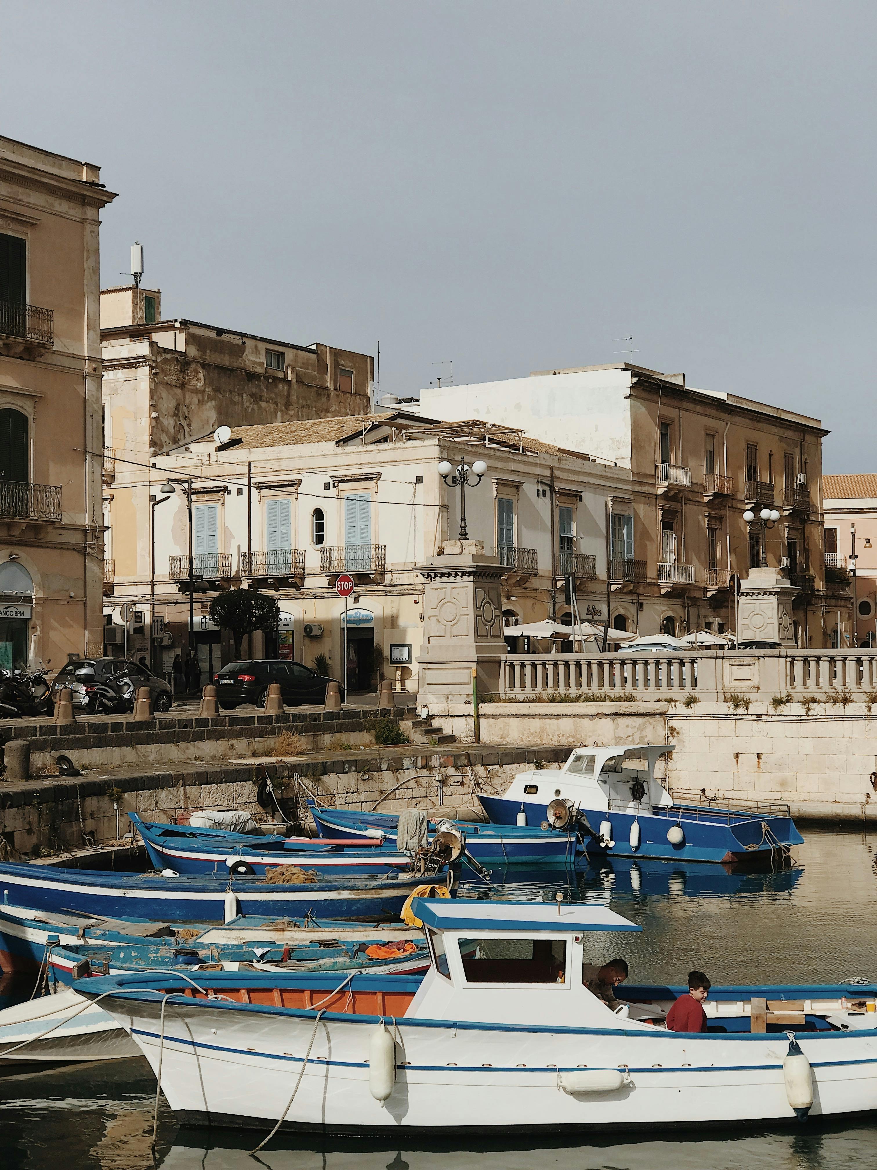 a couple of people that are walking down a street