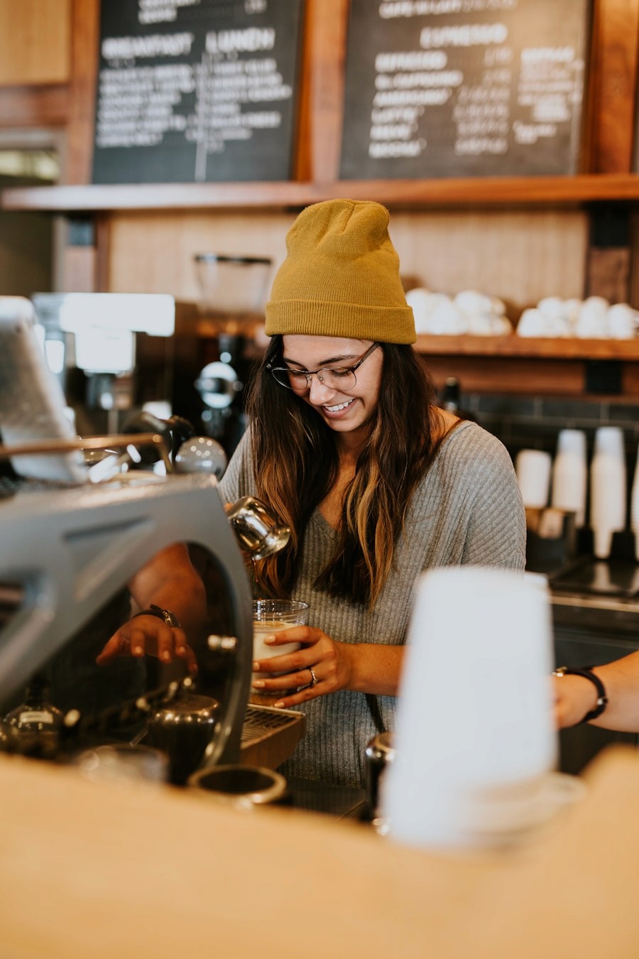 Café team member in warm light