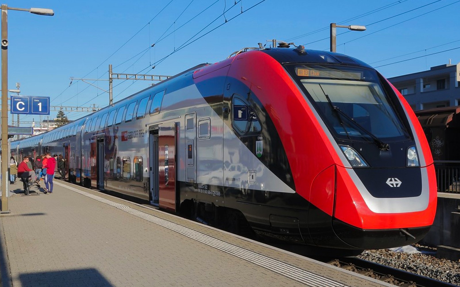 Train at Zurich central station platform for airport transfer.