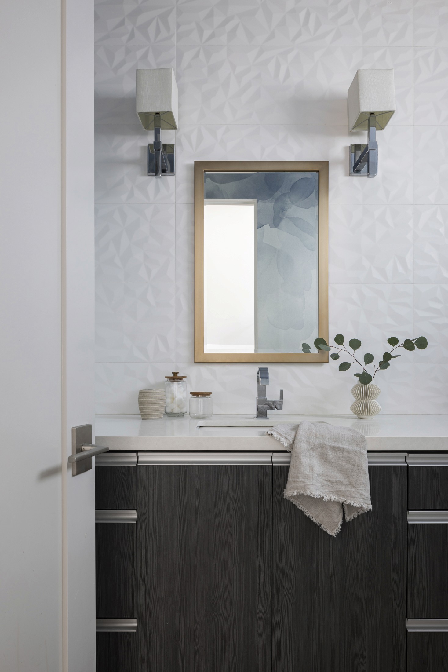 Powder bath with wood vanity mirror and dark cabinetry