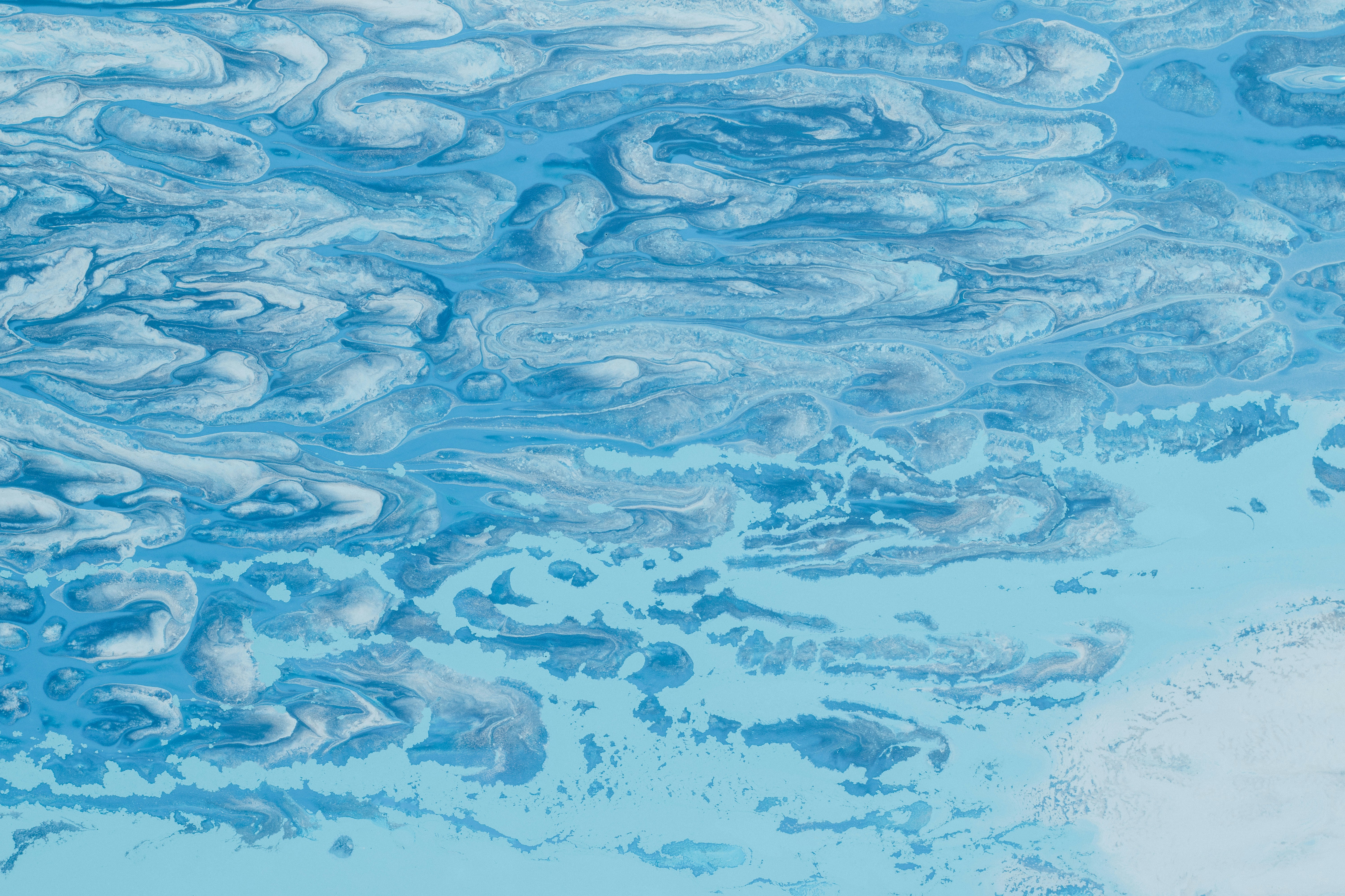 Abstract blue and white swirling patterns