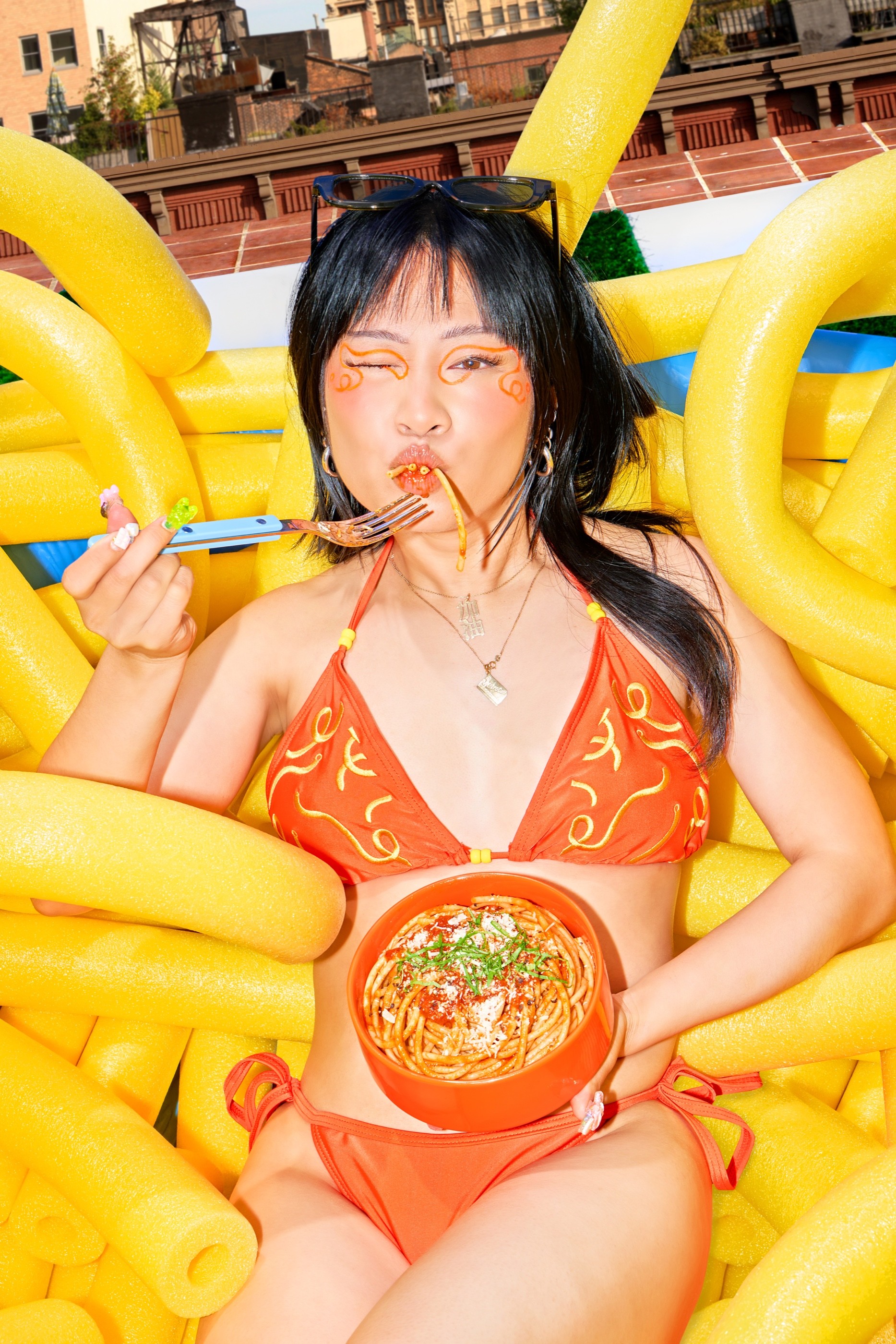 Yu Ling Wu slurping bucatini in the Banza Bucakini campaign