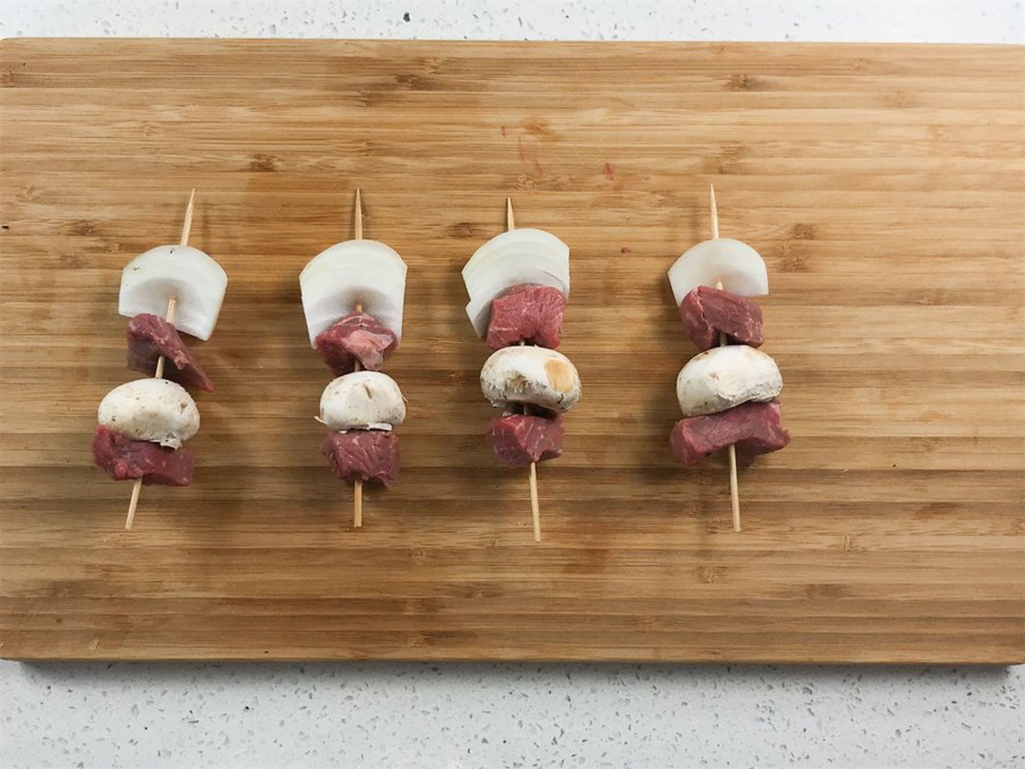 beef, mushrooms and onion threaded in a skewer