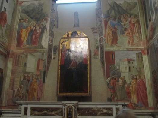 A photo of some frescos depicting different events.