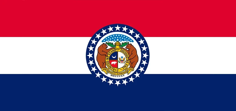 The Missouri state flag displays horizontal red, white, and blue stripes with a circular seal in the center featuring two bears, stars, and an emblem.