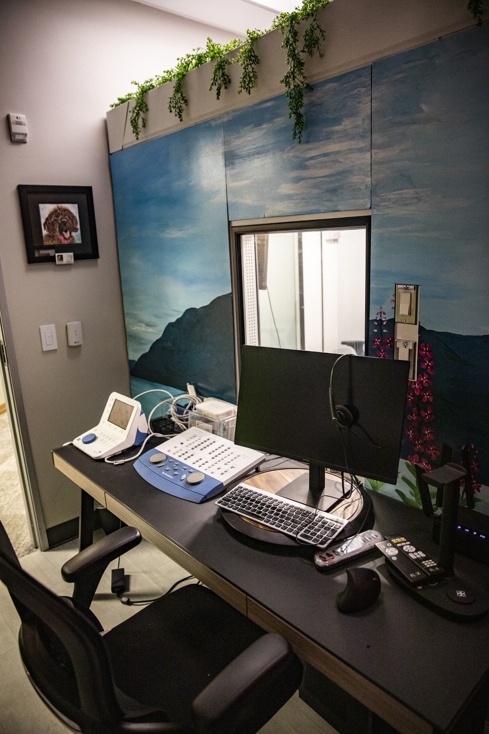 A close-up of a person receiving an ear cleaning, with hands gently handling their ear.