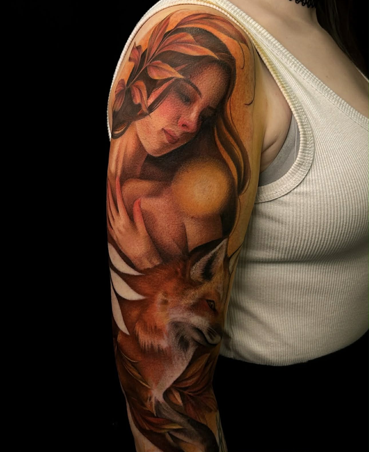 Statue-inspired tattoo featuring peony flower and sacred heart.