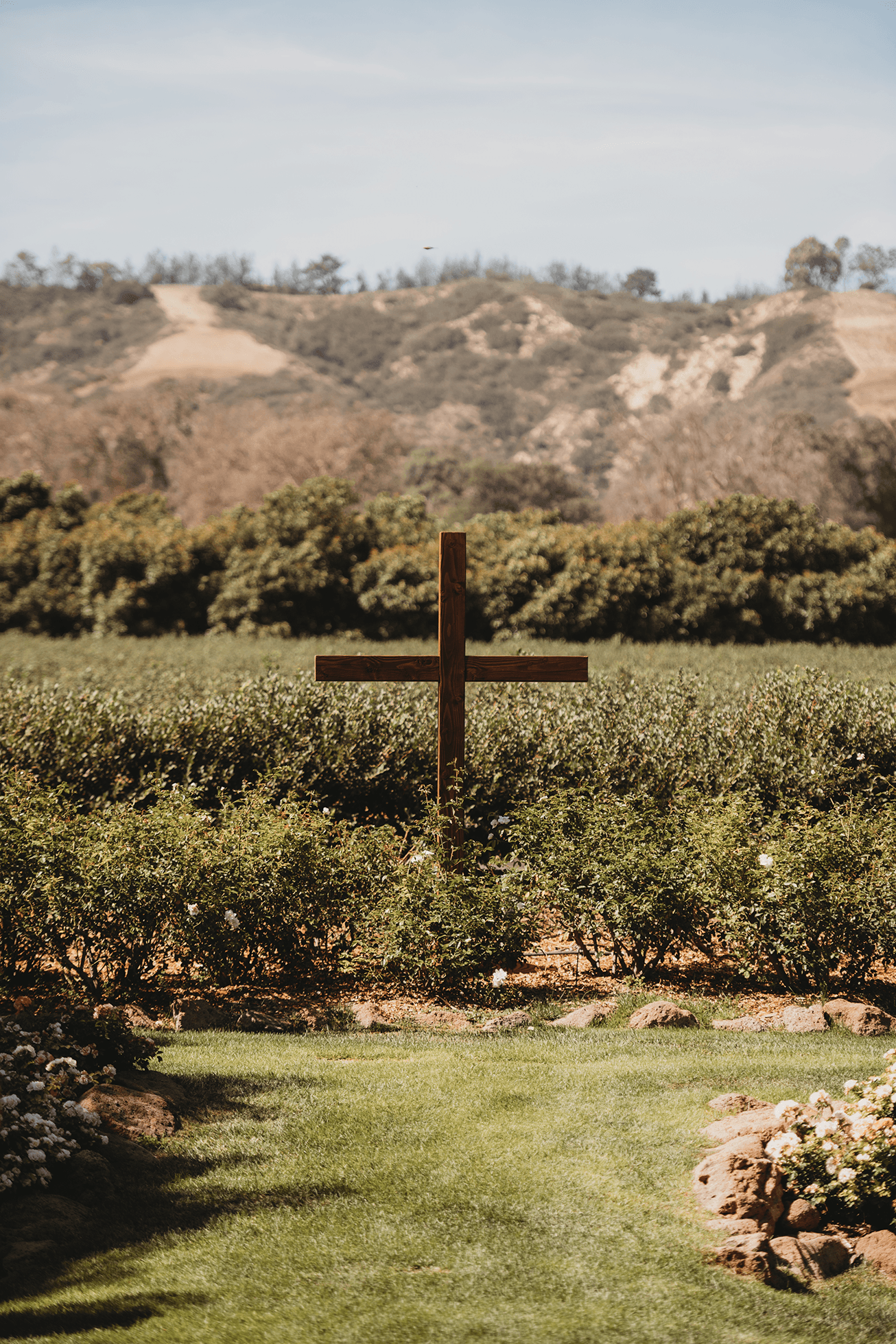 Wooden cross ceremony setup with mountains in the background at Gerry Ranch