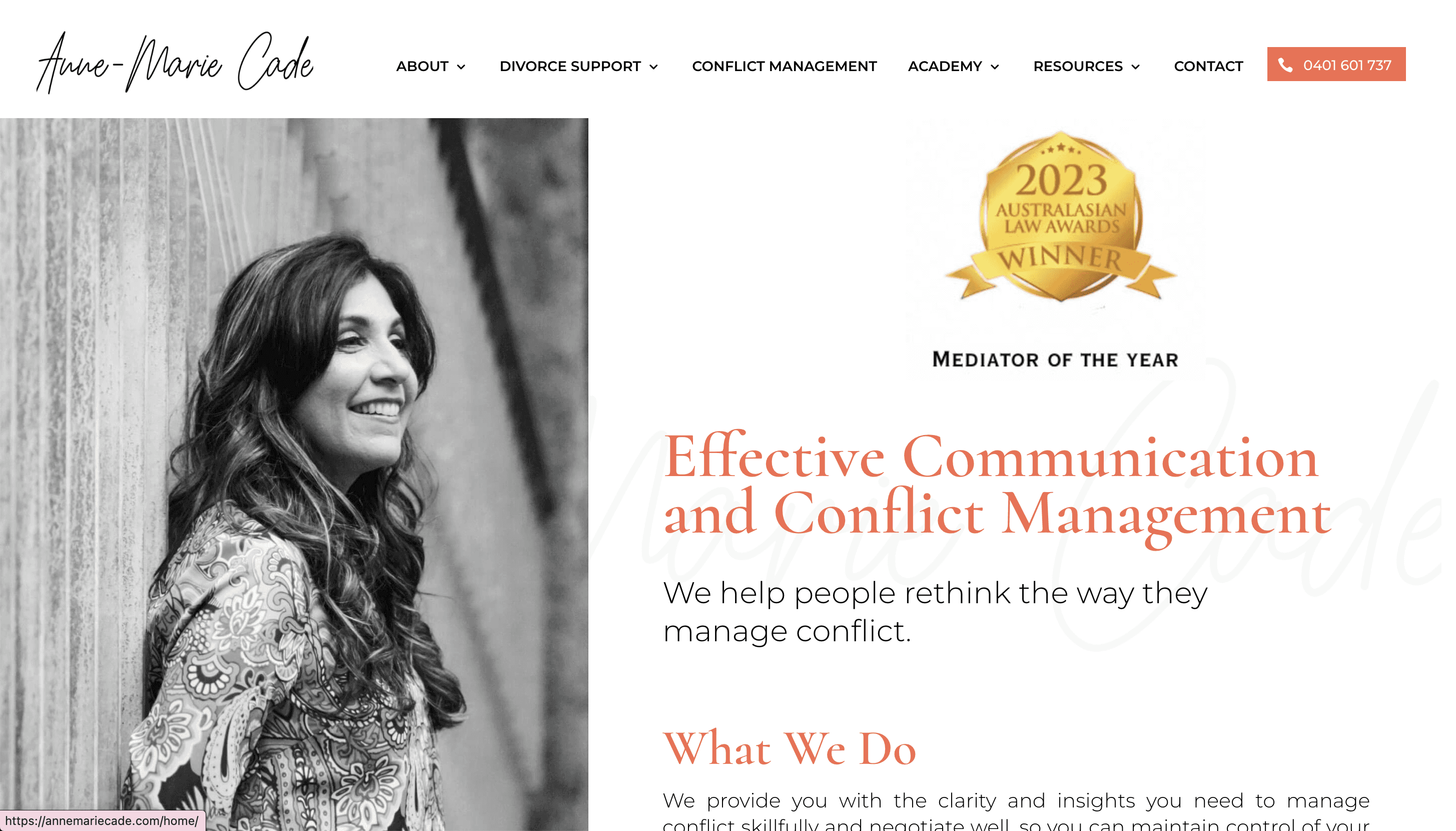 An orange cube-shaped side table is shown.