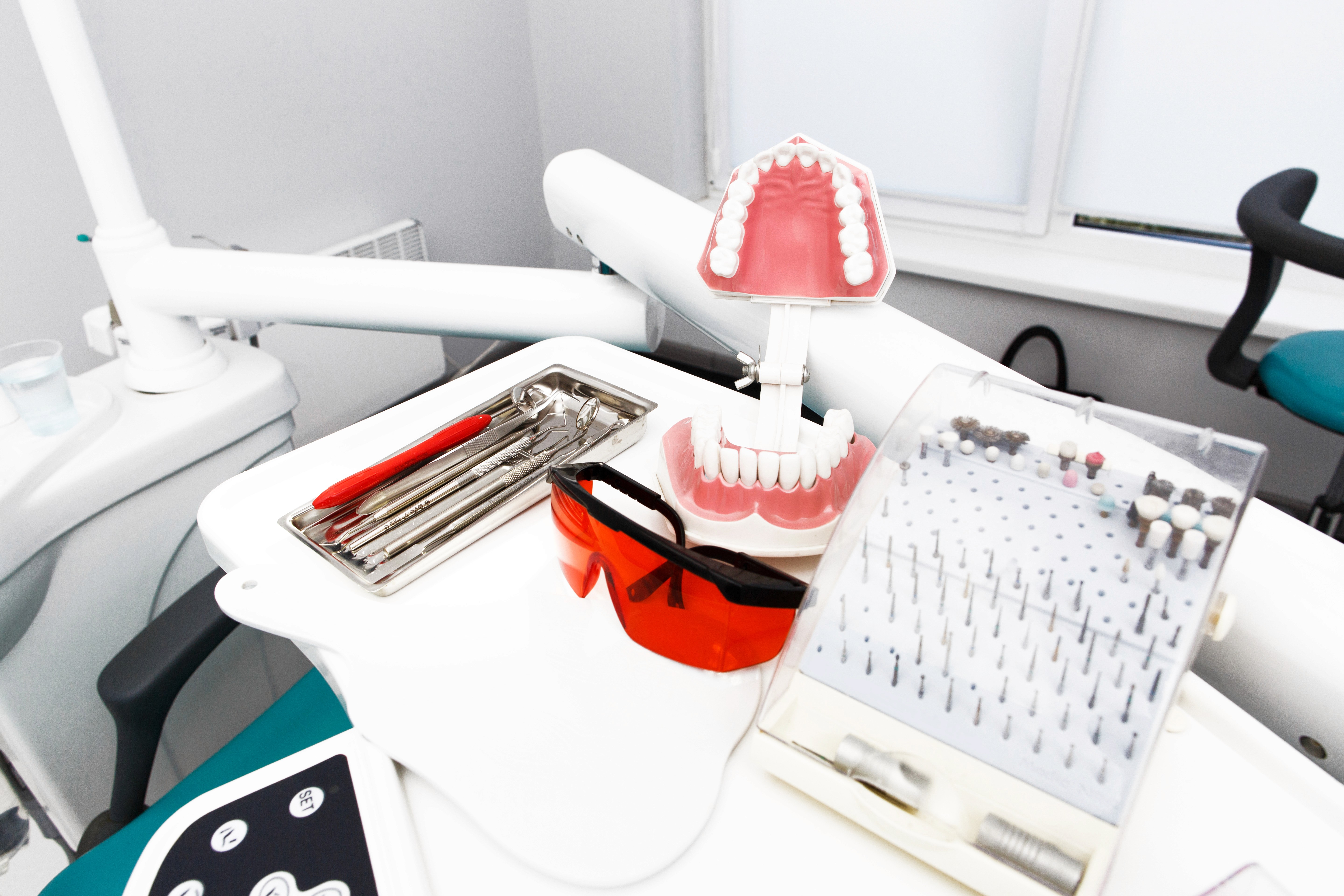 Bachelor of Dental Surgery (BDS) represented by dental instruments, tooth model, and clinical setup used in dental education and practice.