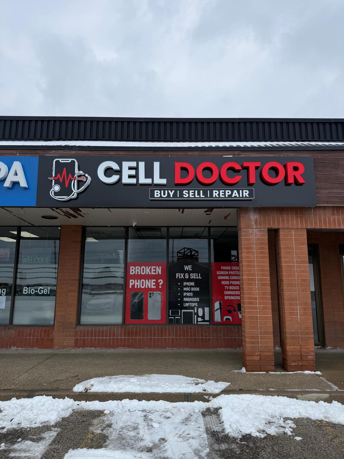 A talent recruiter with a soft smile working on her laptop in the office. The angle is on her face so we can't see what's is on the screen. She is wearing a blazer 