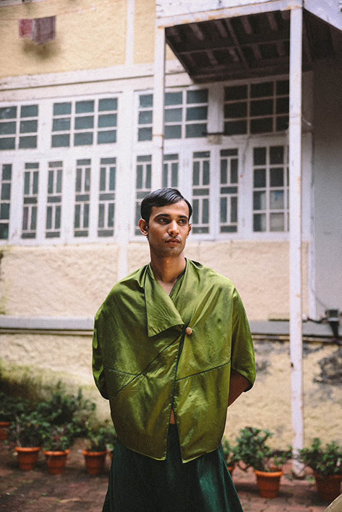 Patang zero-waste folded top with fabric button paired with Paunji dhoti pants featuring structured hem and ankle buttons