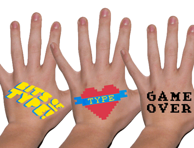 Three hands are shown against a white background. The hand on the left displays the words "BITS OF TYPE!" in yellow block letters. The center hand has a red heart shape with a blue ribbon across it, labeled "TYPE" in yellow. The hand on the right has the words "GAME OVER" in black block letters.
