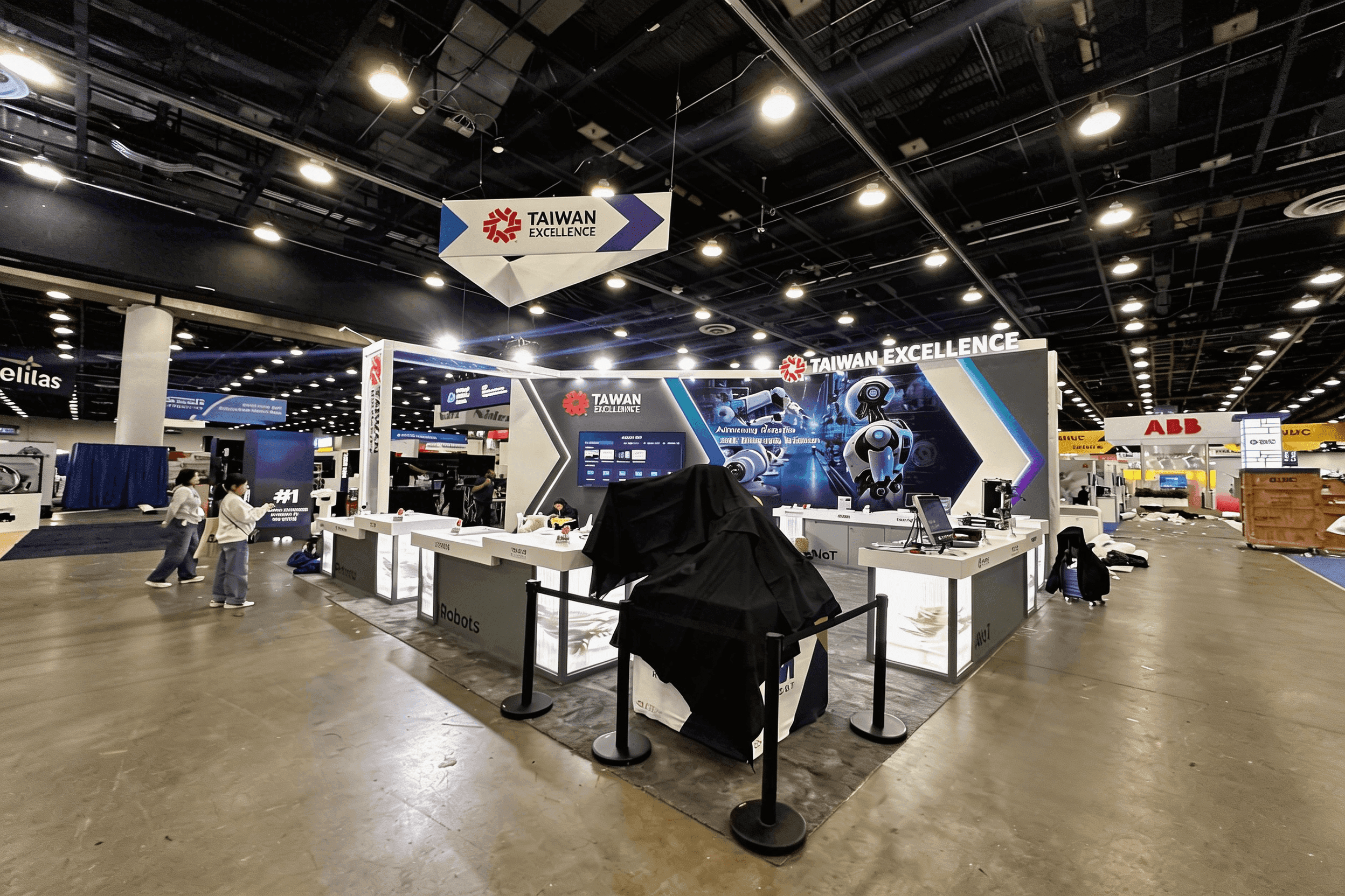 custom-built design and manufacturing booth with equipment-ready structure and engineering discussion area