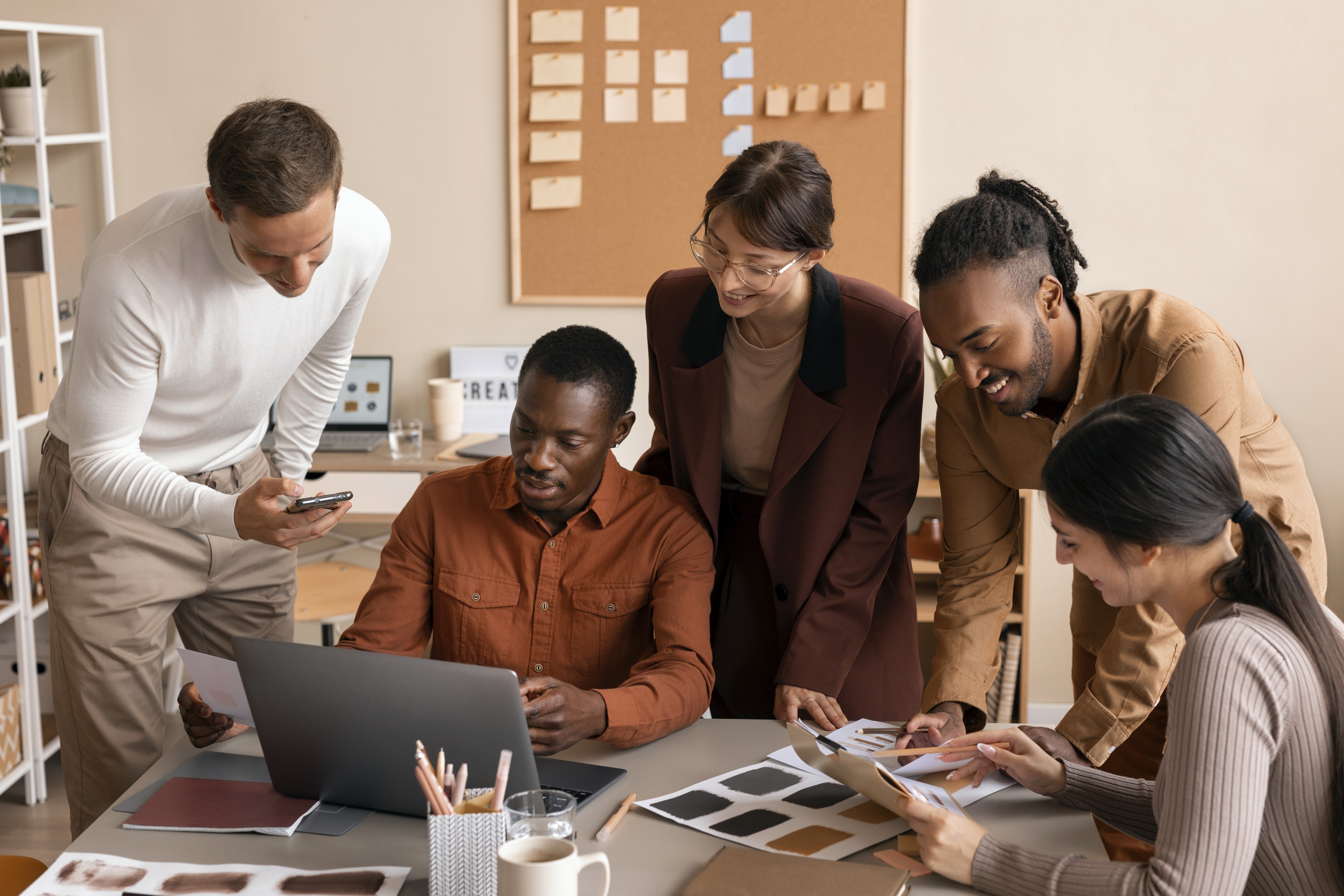 Modern glass and steel building with warm wooden ceilings, surrounded by lush greenery, blending contemporary architecture with nature.