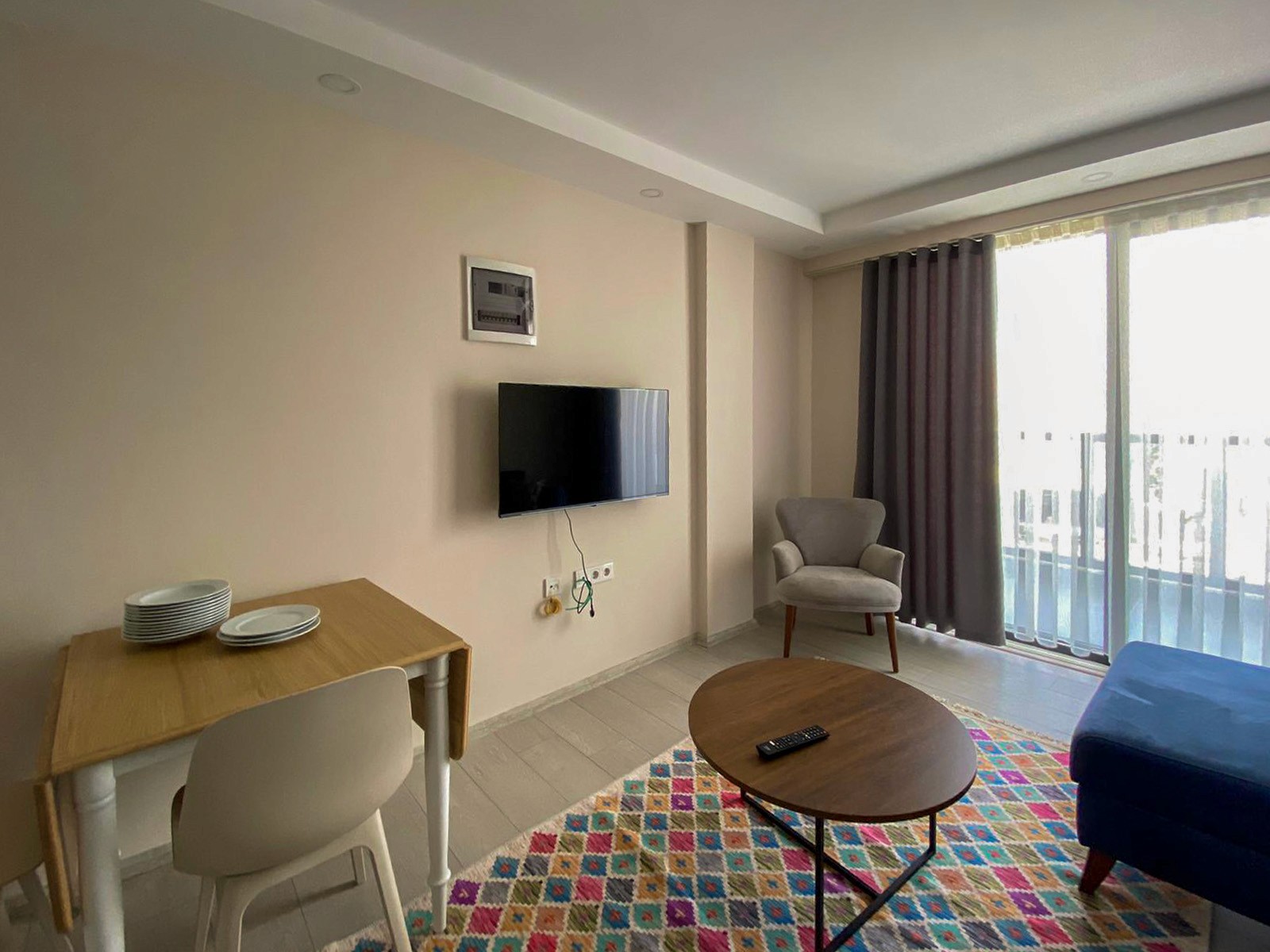 Living area and kitchen in duplex 1 bedroom apartment at Zen Garden Suites Side Antalya