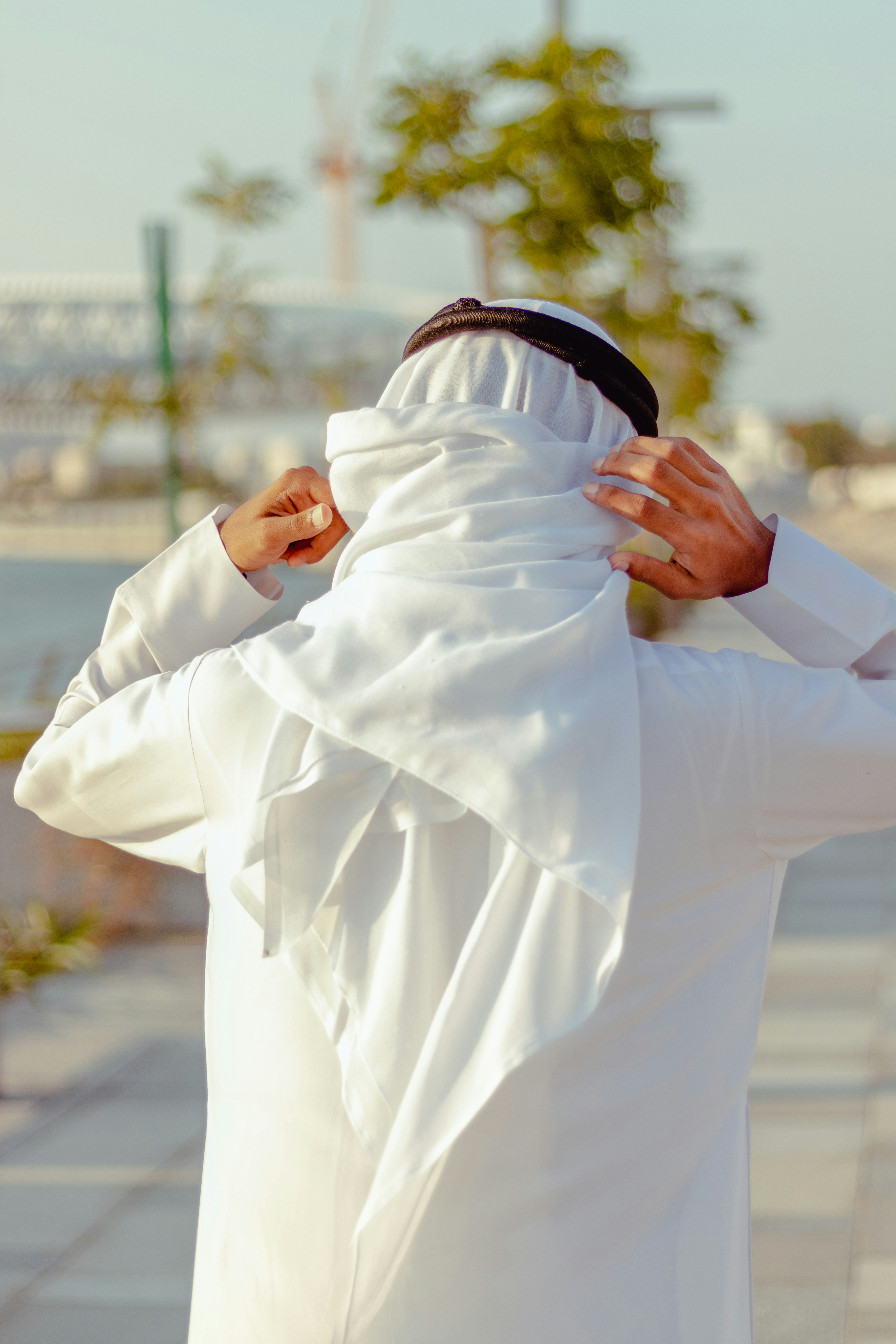 arab man in white long sleeve shirt