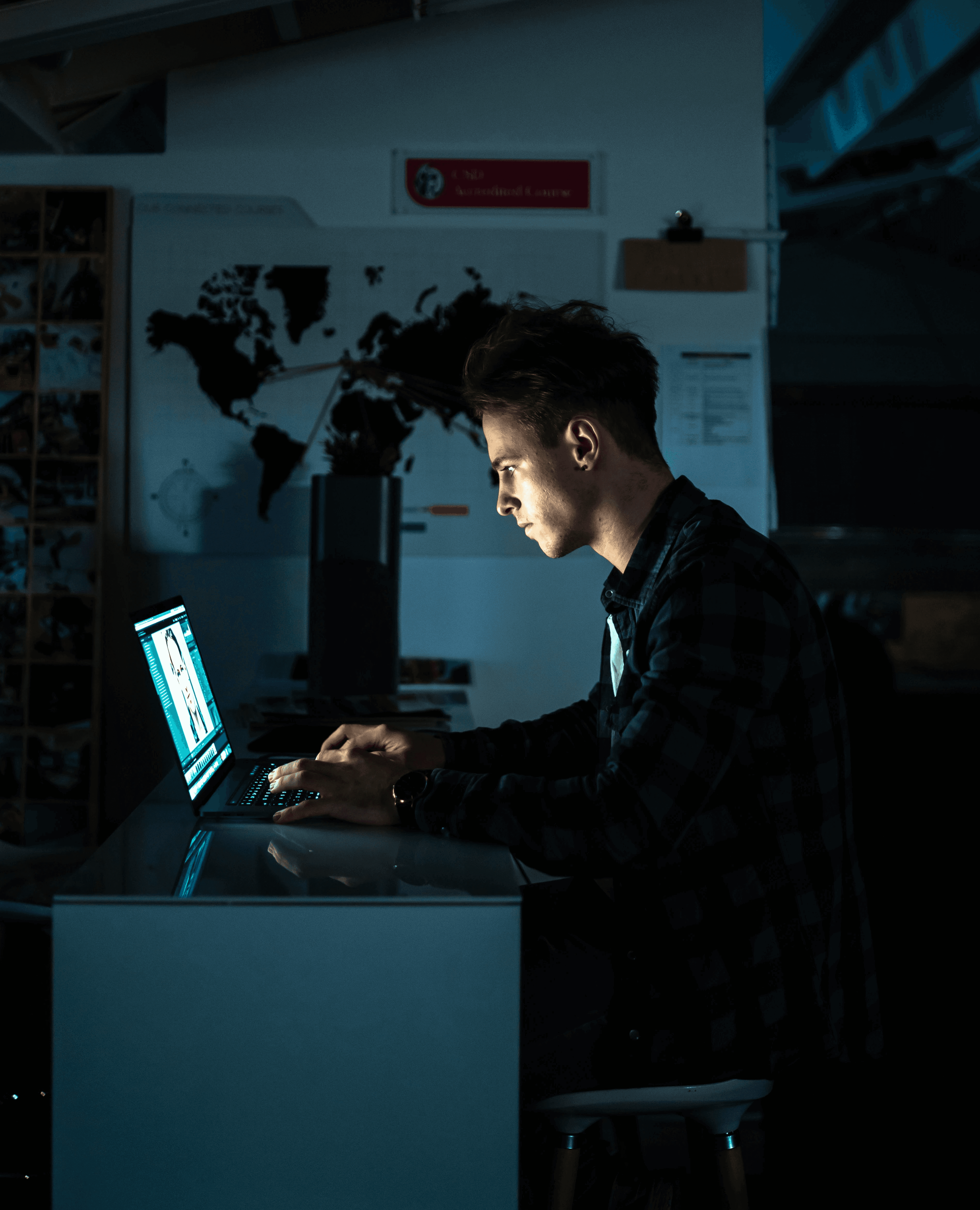 man sitting in front of a computer