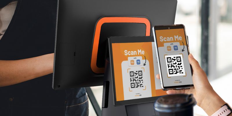 A customer scanning a QR Code on a StoreHub POS at an F&B Business