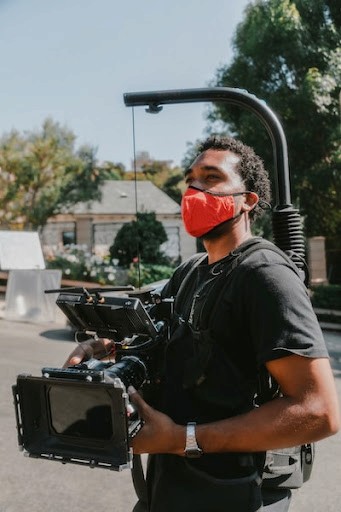 camera operator holding a cinema camera