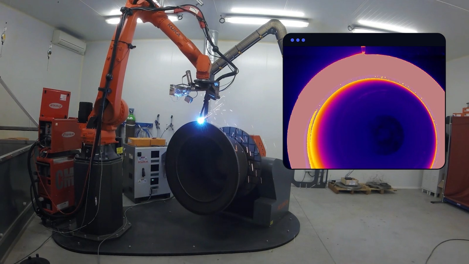 Black and white image of people working at a table with laptops, showing hands gesturing during discussion of digital content displayed on screens, with fabrica® logo in the corner.