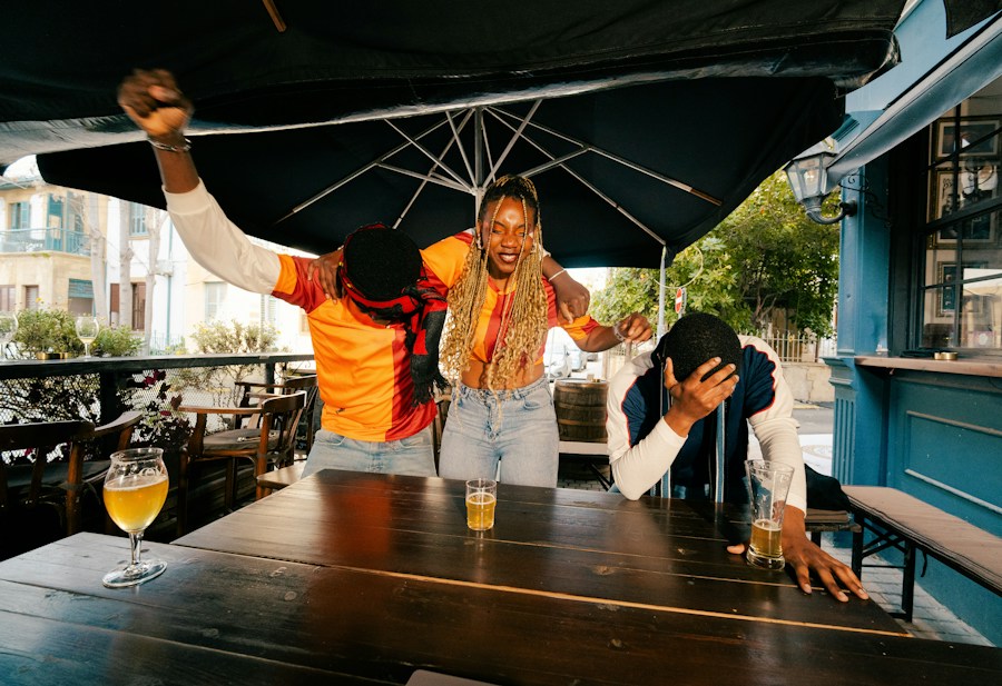 Friends enjoying drinks at an outdoor bar