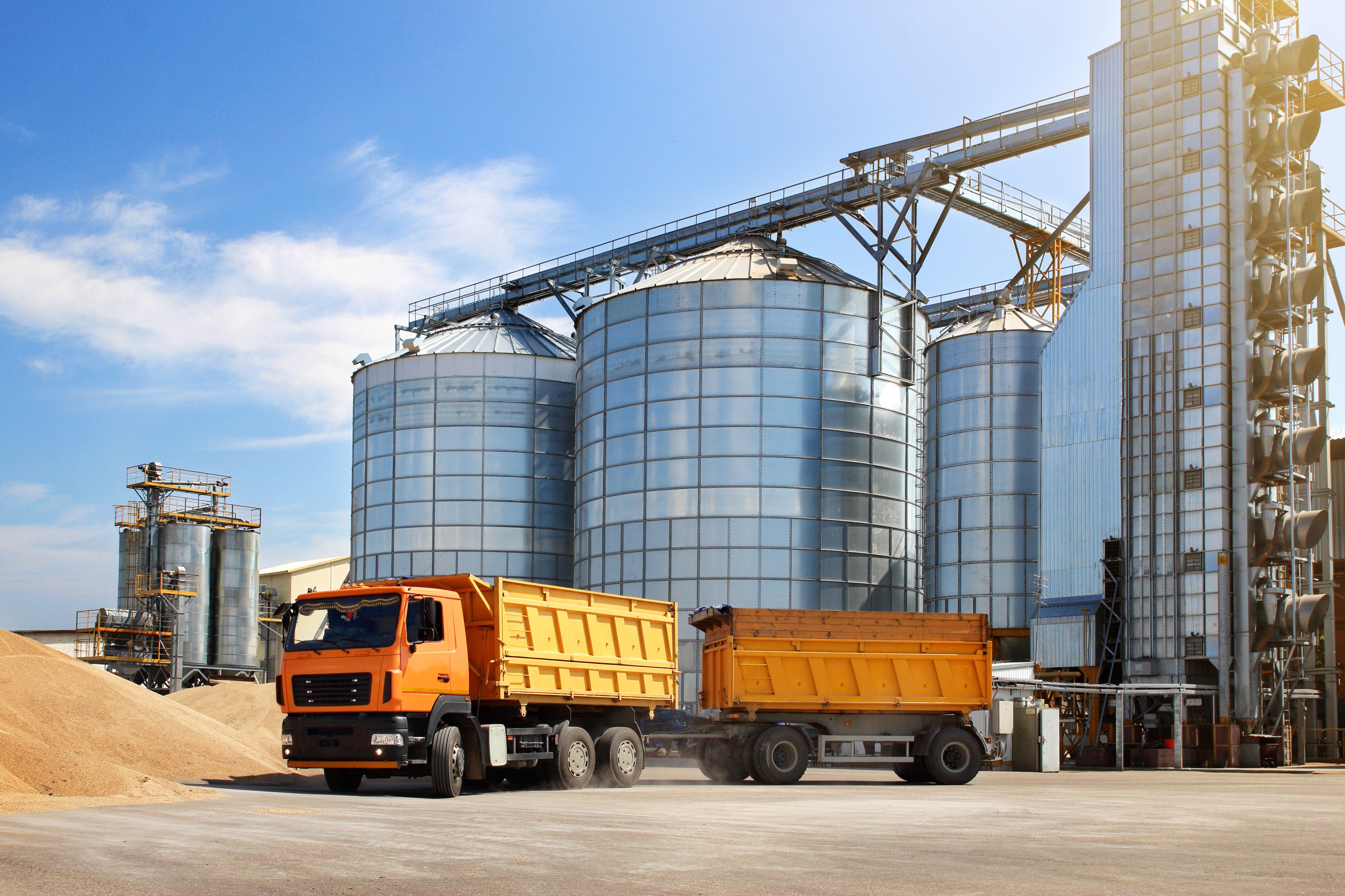 Yellow truck in front of grain elevator