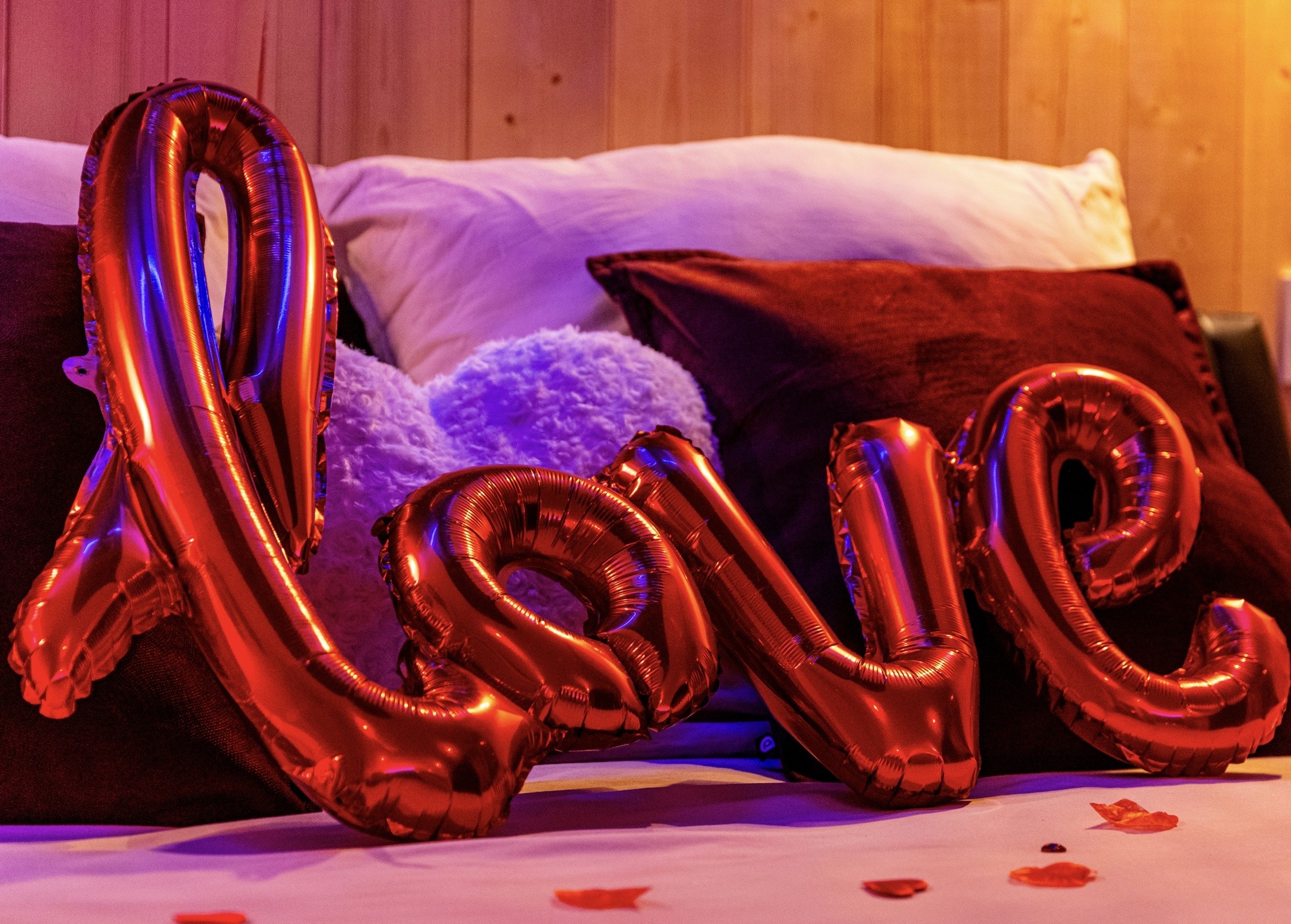 Sunlight streams through a narrow sandstone canyon.