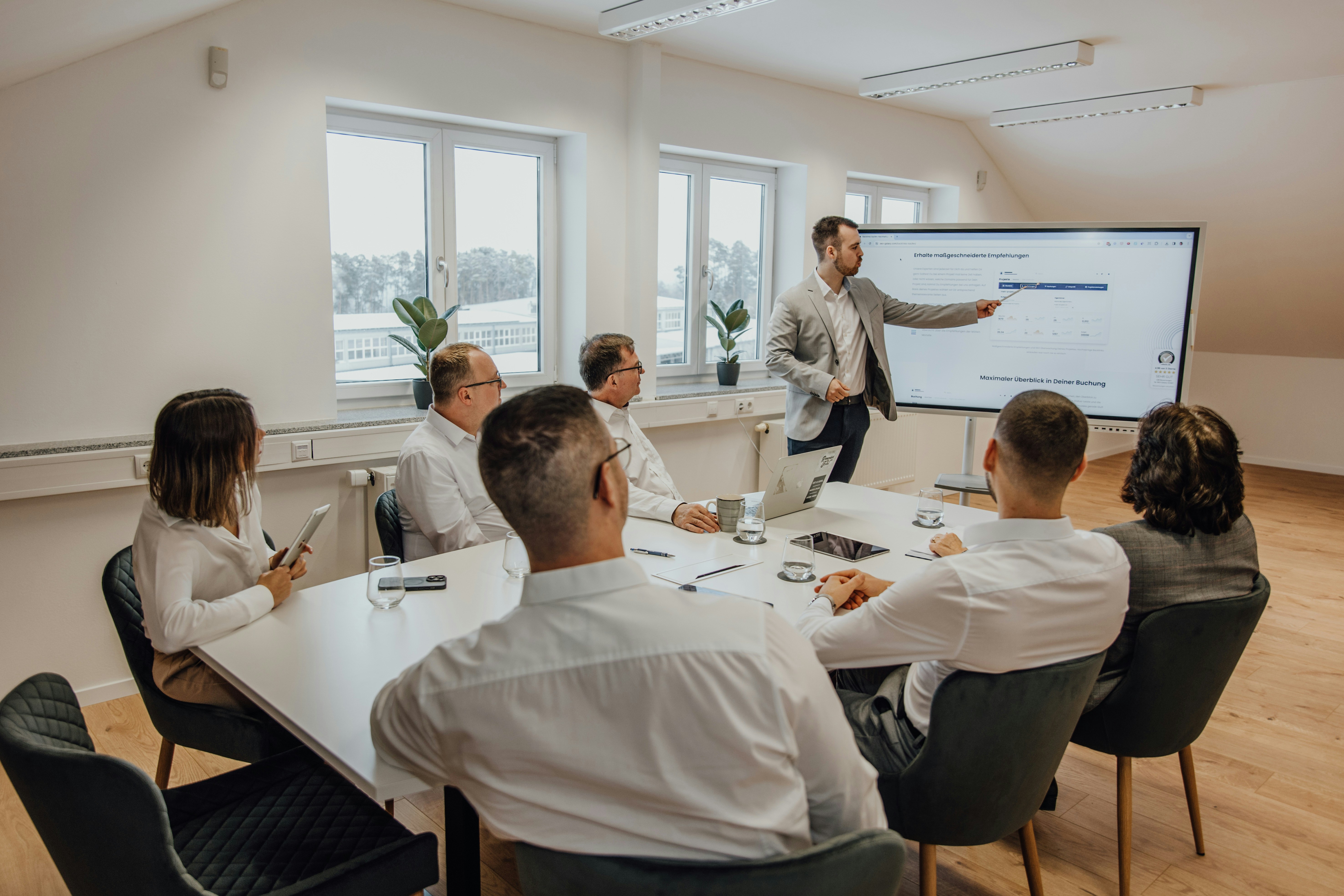 man speaking at a conference room