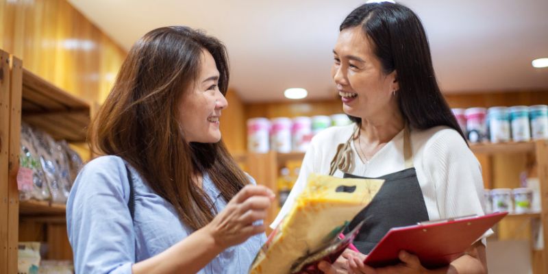 A retail store staff helping a customer
