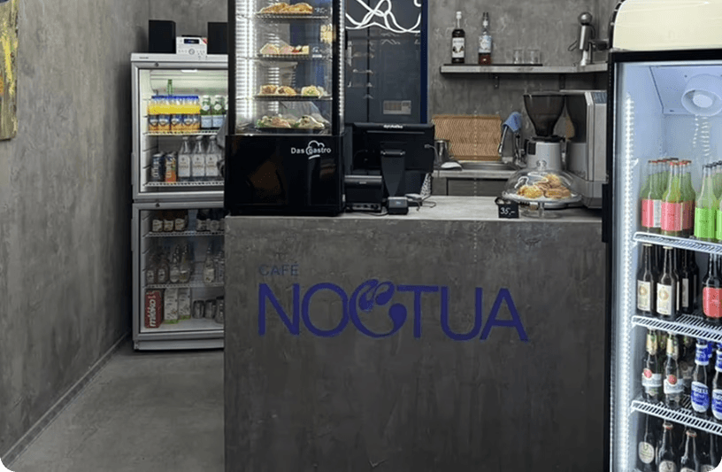 Noctua café identity applied across coffee packaging and the physical space