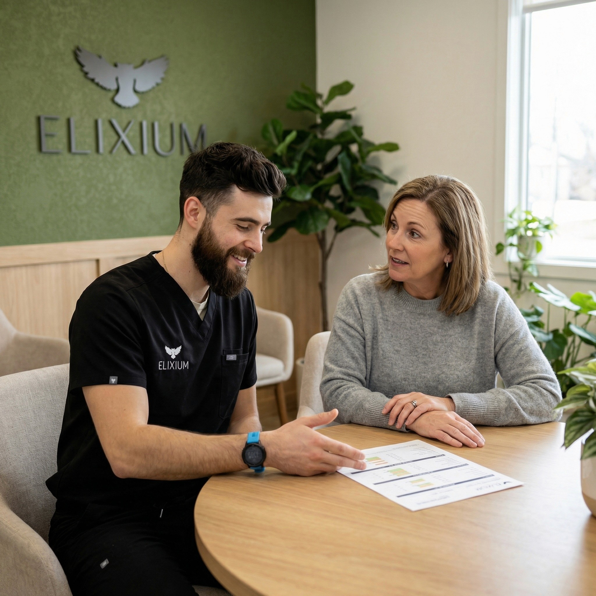a staff member from Elixium Health talking to a person