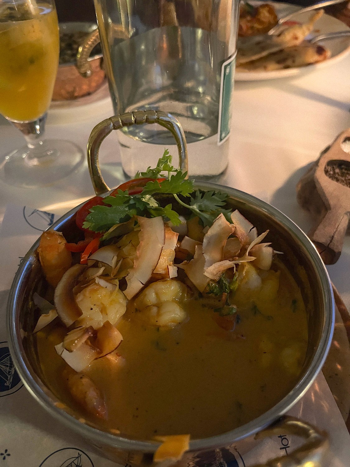 A shrimp curry dish on a table.