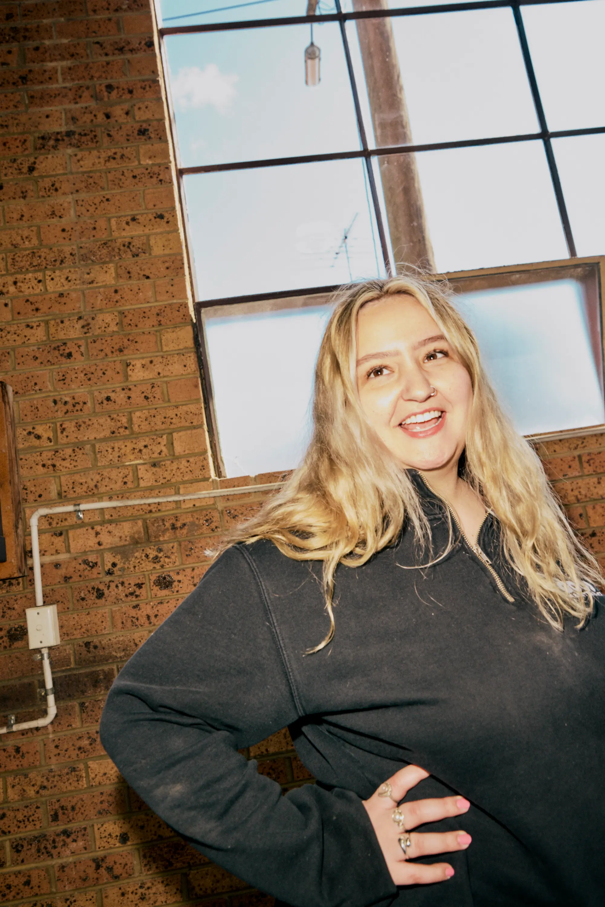 Team Member at Good Maintenance headquarters, smiling for the camera.