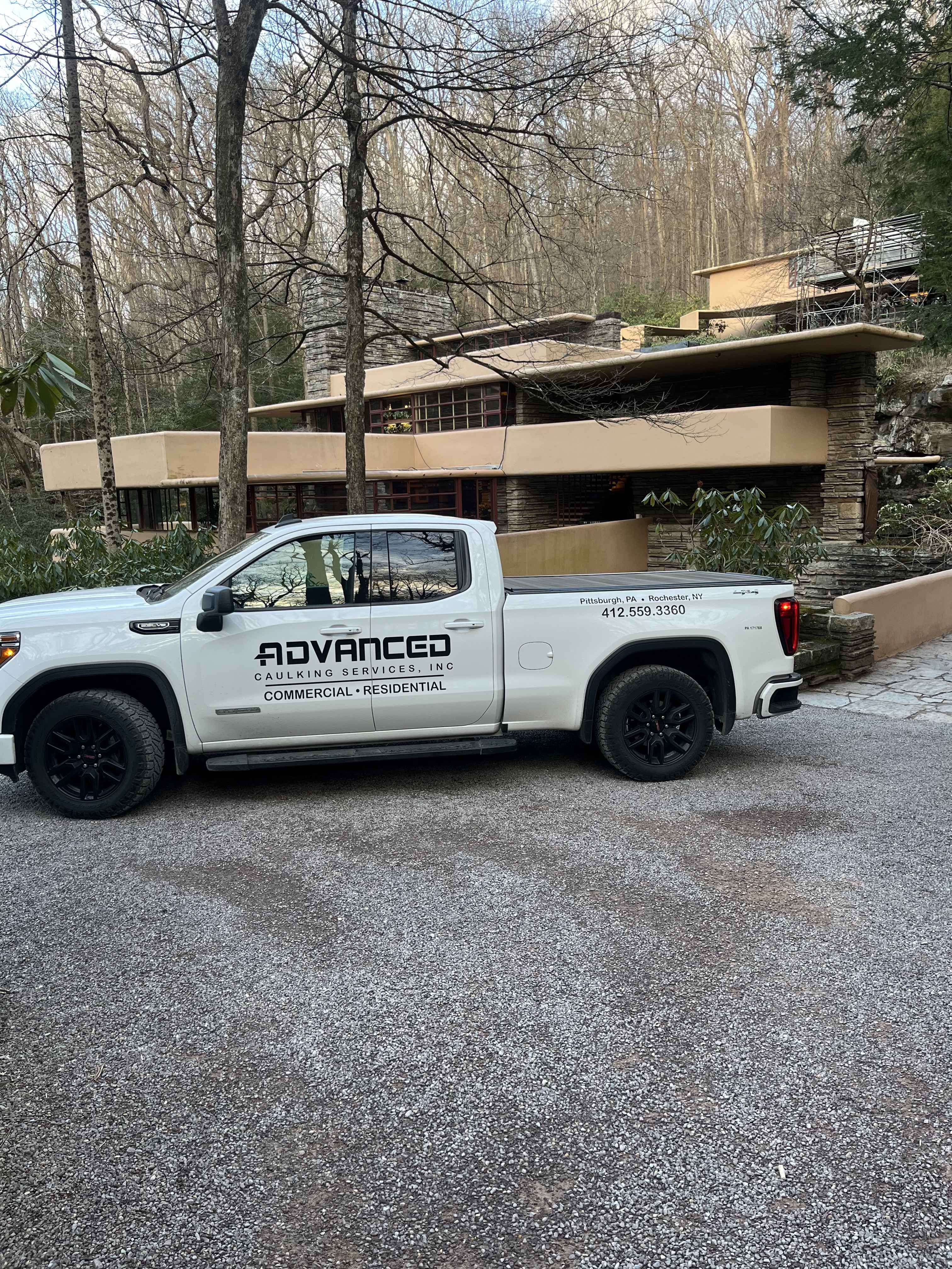 Advanced Caulking Truck in front of Falling Water