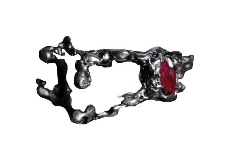 Sculpted silver ring with rough, uneven surface with red stone