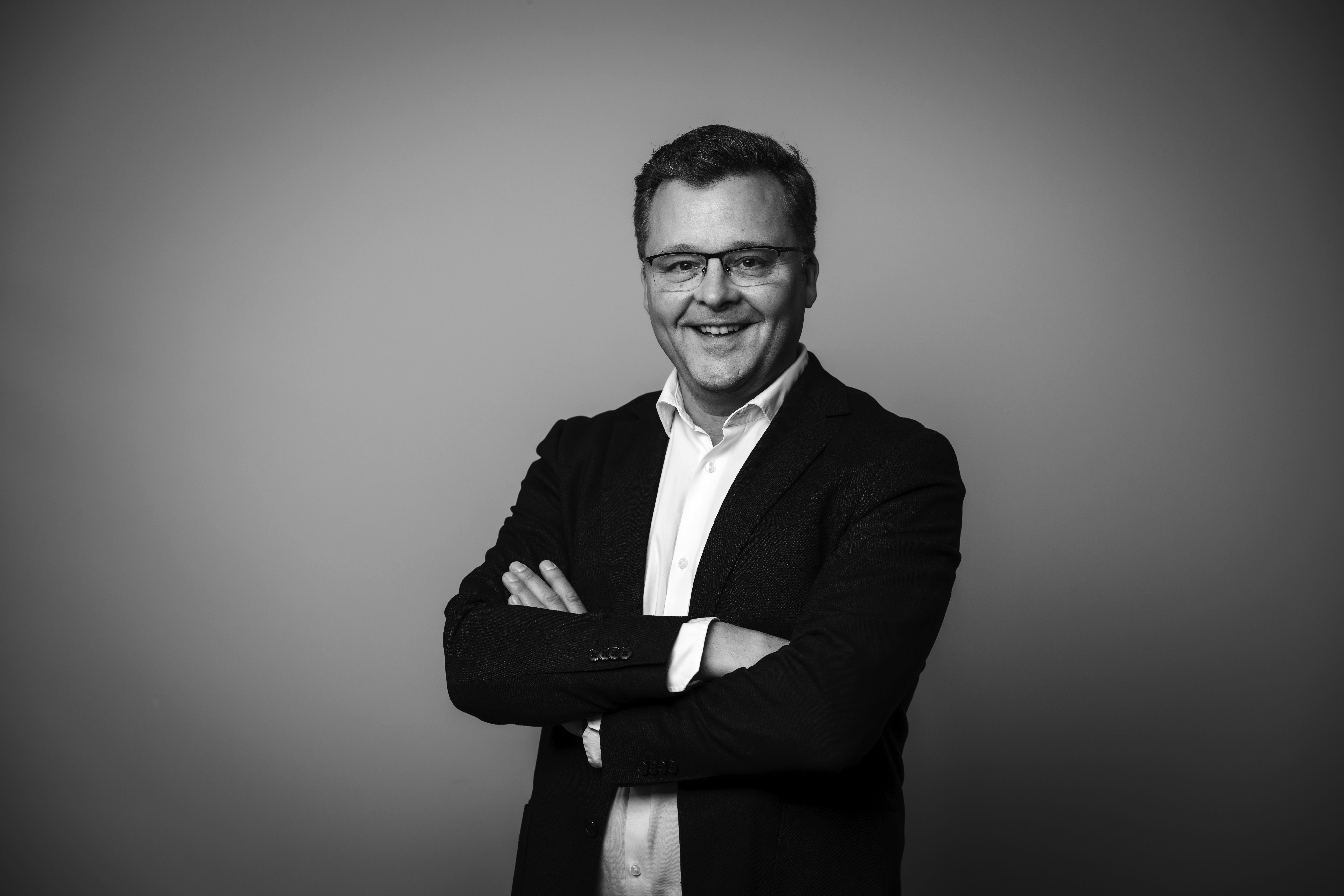 a man in a yellow shirt is on a red track