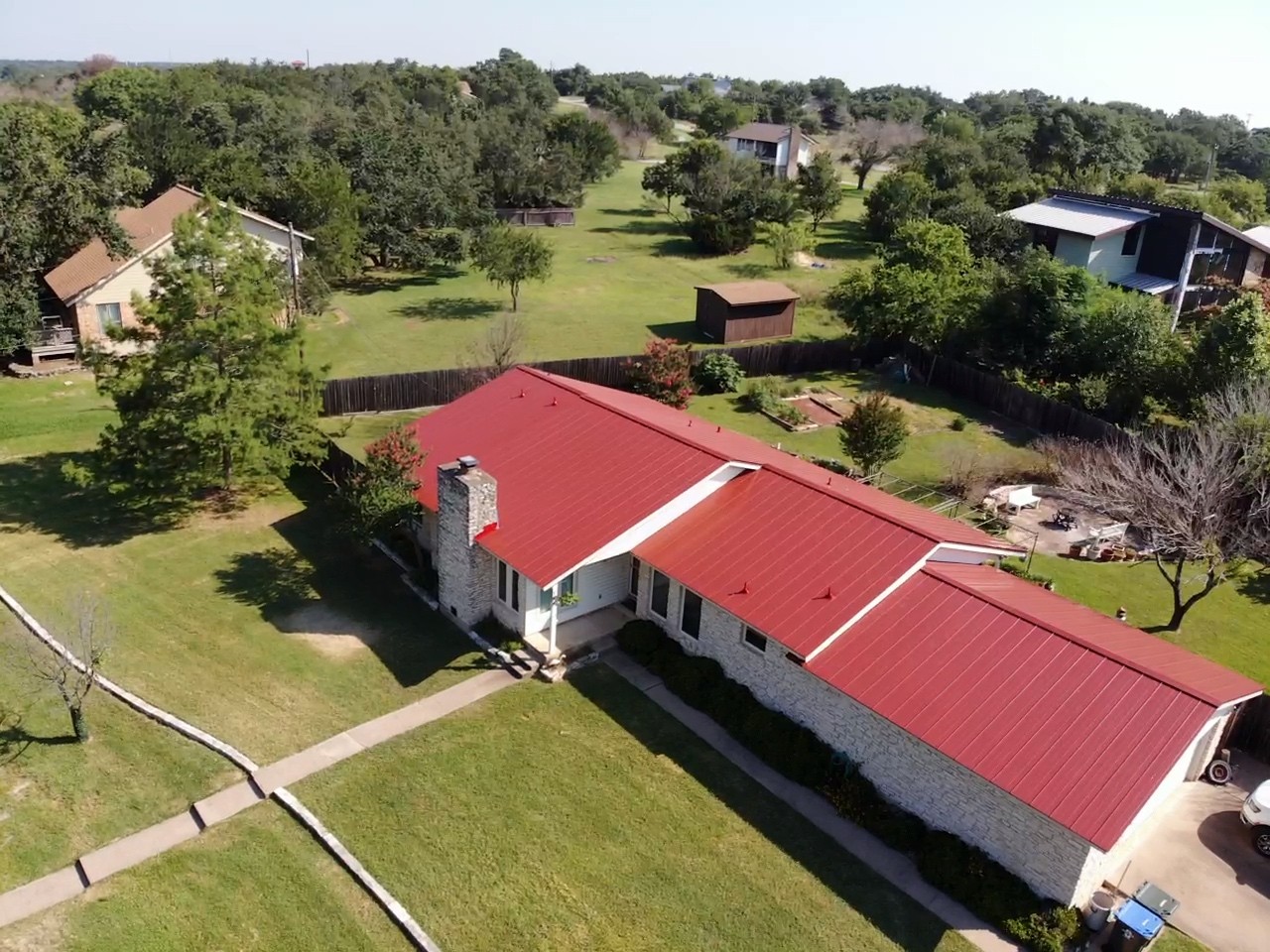 A sleek standing seam 24-gaug bright red finish galvalume roof with clean lines and a durable, energy efficient reflective finish.