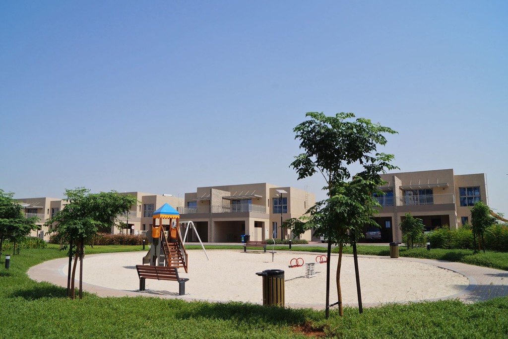 Cedre Villas in Dubai Silicon Oasis features a playground with swings and slides.
